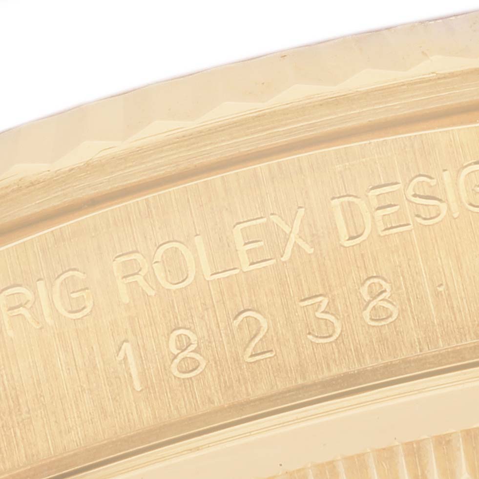 This is a close-up image of the engraved model number and bezel of a Rolex President 18238 Men
s Yellow Gold Champagne Dial 18238 Men
s Yellow Gold Champagne Dial watch.
