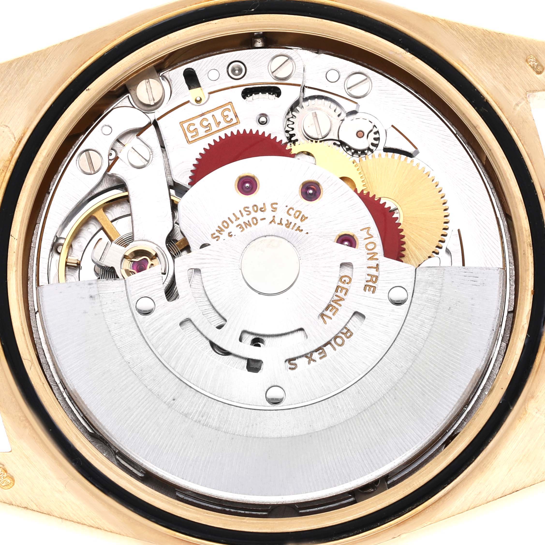 The image shows a close-up view of the movement of a Rolex President 18238 Men
s Yellow Gold Champagne Dial 18238 Men
s Yellow Gold Champagne Dial model watch, highlighting gears and internal mechanisms.