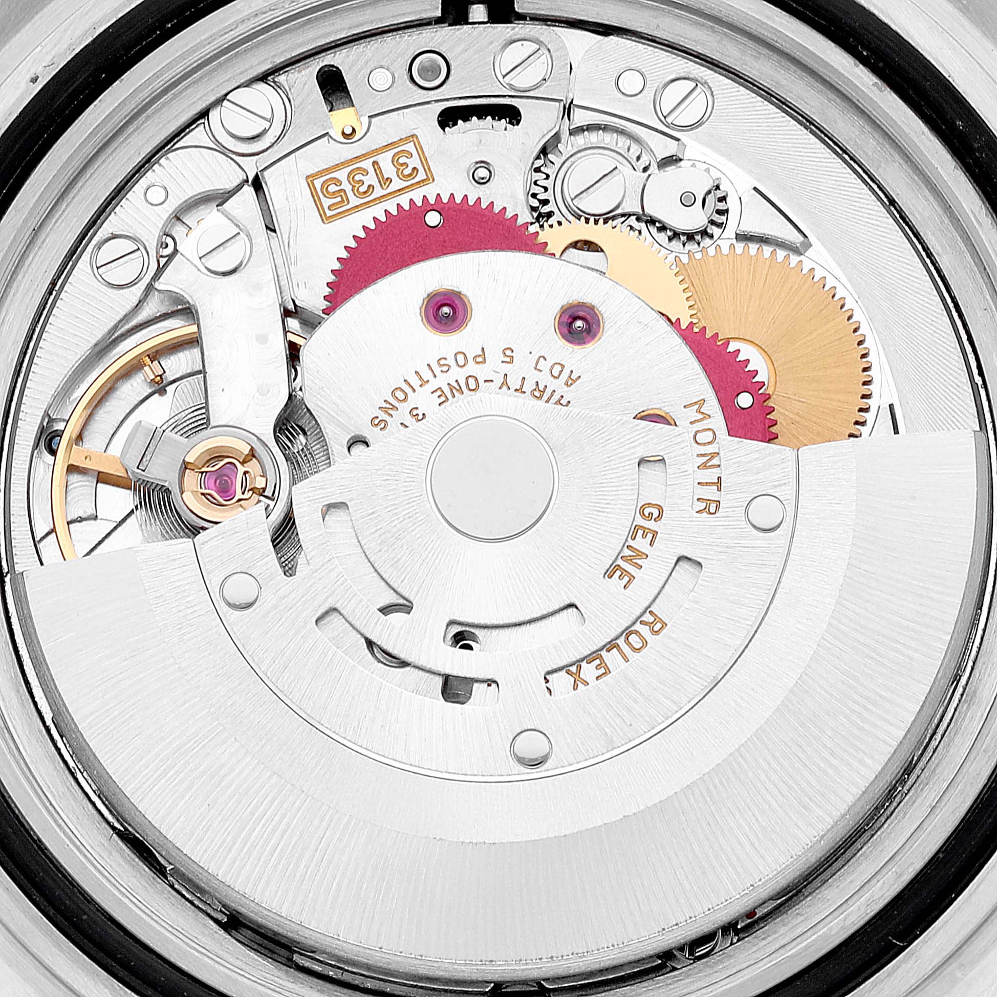 This image shows an up-close view of the movement mechanism inside a Rolex Submariner 16610 Men
s Stainless Steel Black Dial 16610 Men
s Stainless Steel Black Dial watch, highlighting gears, springs, and other components.