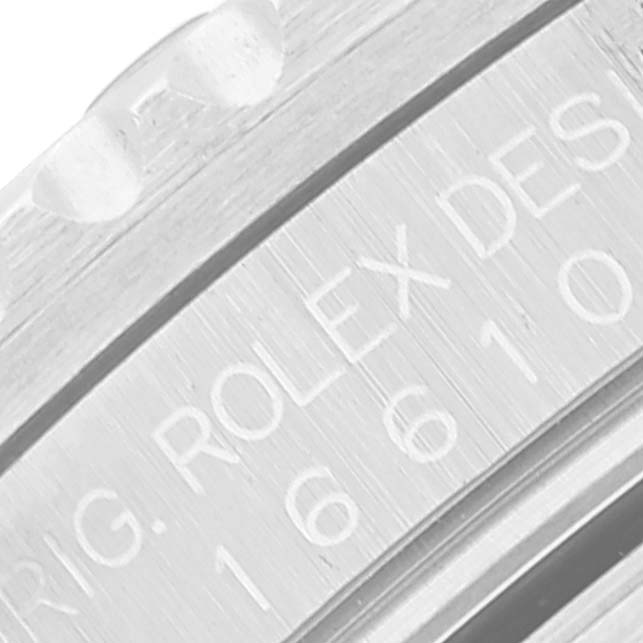 The image shows a close-up of the engraved bezel and case side of a Rolex Submariner 16610 Men
s Stainless Steel Black Dial 16610 Men
s Stainless Steel Black Dial.