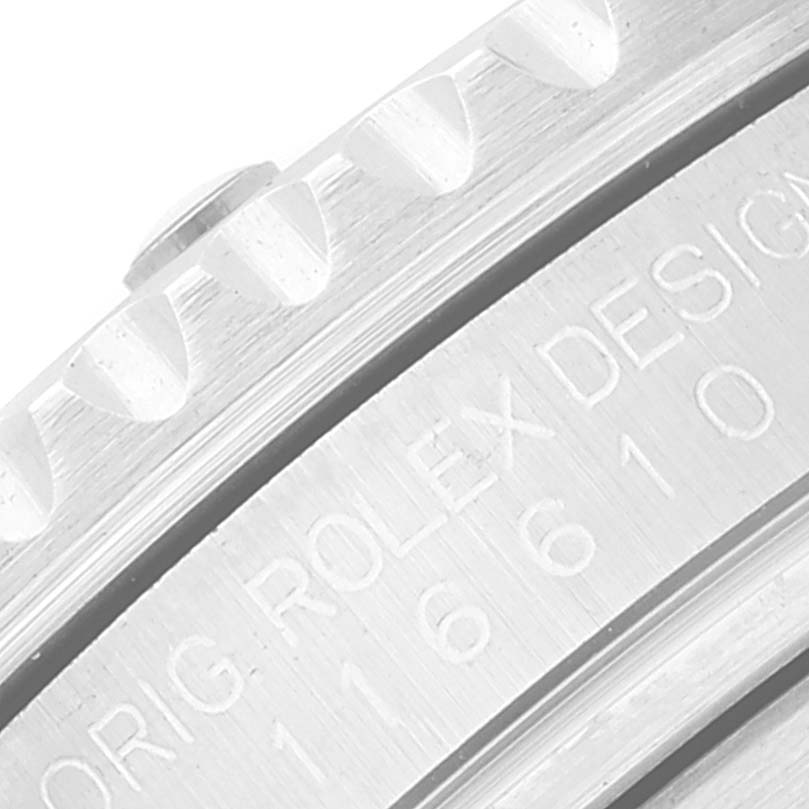 The image shows a close-up of the bezel and part of the engraved caseback of a Rolex Submariner 116610LV Men
s Stainless Steel Green Dial 116610LV Men
s Stainless Steel Green Dial watch.