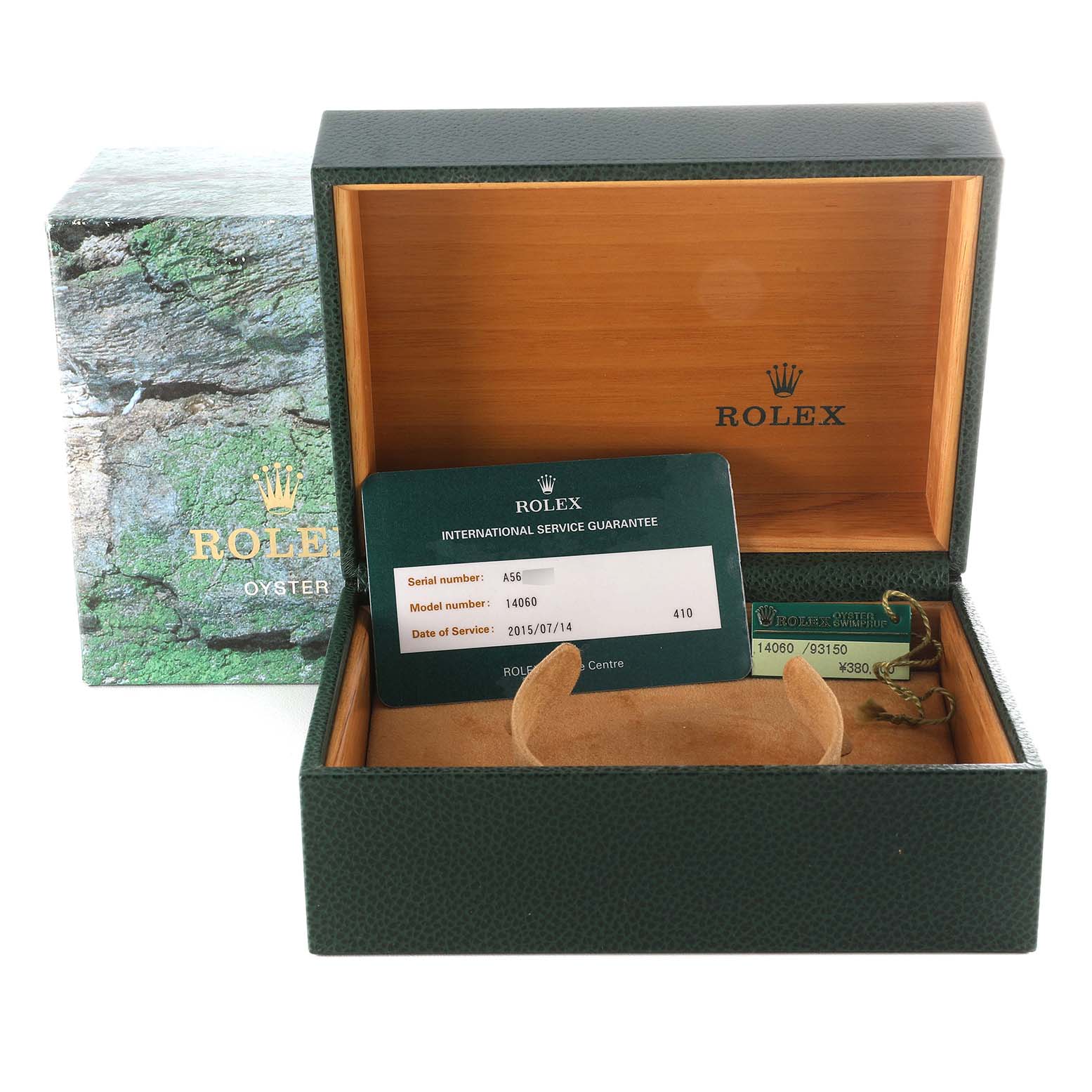 This image shows the box, warranty card, and tag of a Rolex Submariner 14060 Men
s Stainless Steel Black Dial 14060 Men
s Stainless Steel Black Dial watch.