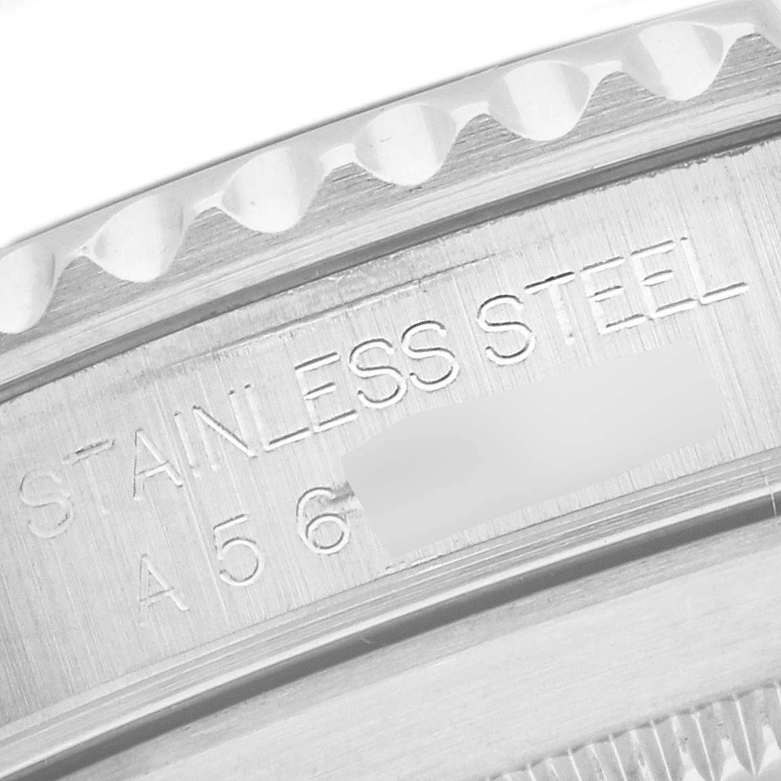 This close-up image shows the side view of the bezel and the engraved details of the stainless steel casing on a Rolex Submariner 14060 Men
s Stainless Steel Black Dial 14060 Men
s Stainless Steel Black Dial watch.