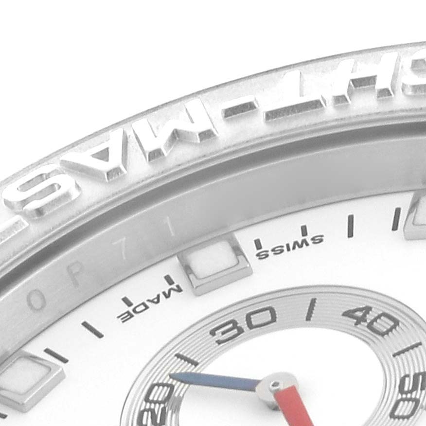 This close-up shot of the Rolex Yacht-Master 116689 Men's Stainless Steel White Dial 116689 Men's Stainless Steel White Dial watch shows part of the bezel, dial, and hands.