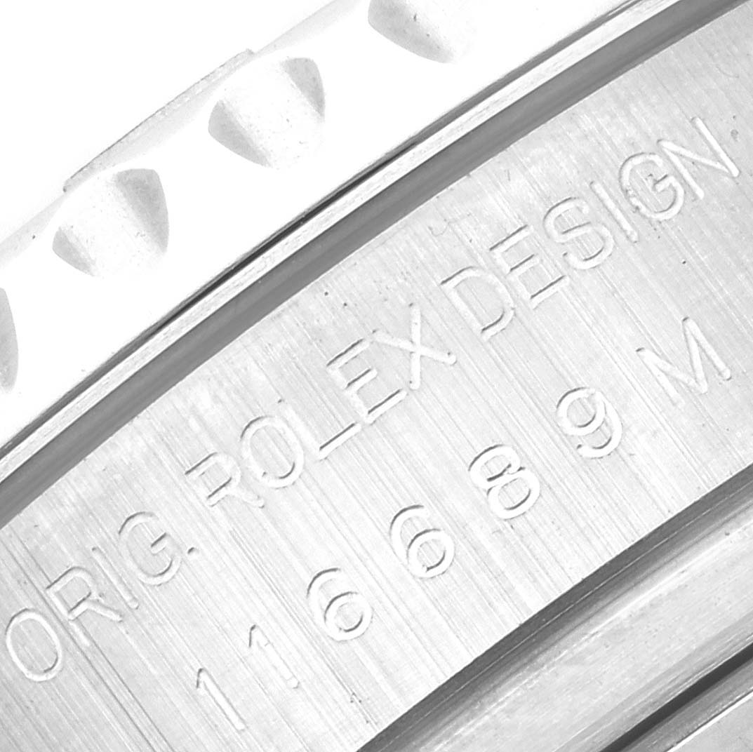 The image shows a close-up of the case engraving on a Rolex Yacht-Master 116689 Men's White Gold White Dial 116689 Men's White Gold White Dial watch, displaying the model number and "ROLEX DESIGN".