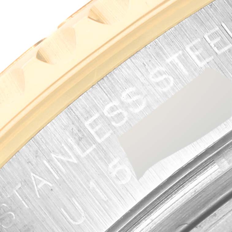 The image shows a close-up of the stainless steel and gold bezel of a Rolex Yacht-Master 69623 Women
s Steel and Gold (two tone) Grey Dial 69623 Women
s Steel and Gold (two tone) Grey Dial watch.