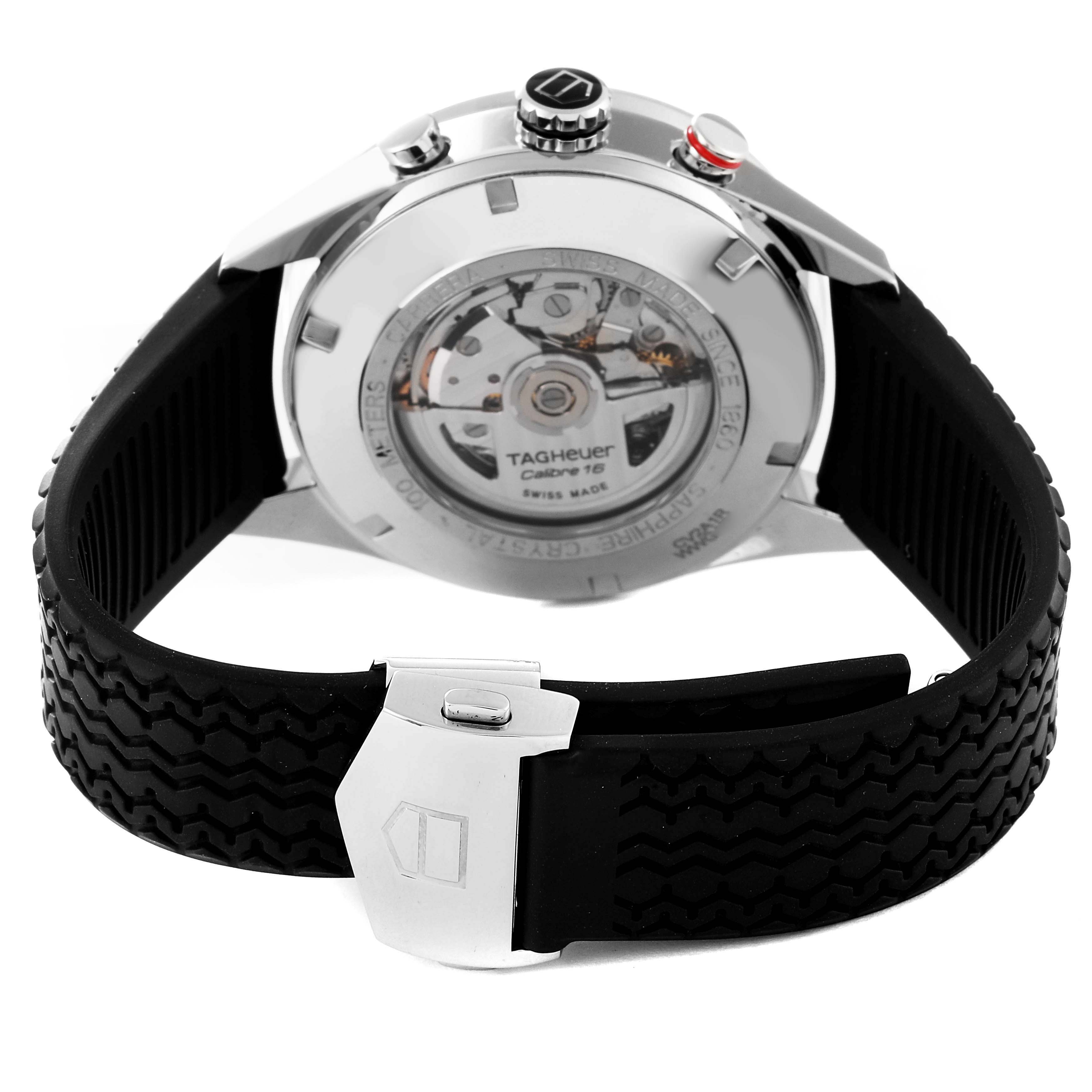 The image shows the back view of a Tag Heuer Carrera CV2A1R Men
s Stainless Steel Black Dial CV2A1R Men
s Stainless Steel Black Dial watch, highlighting the movement and rubber strap with a clasp.