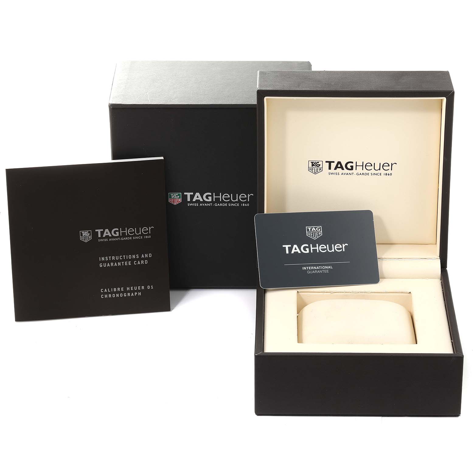 The image shows a Tag Heuer Carrera CAR2A1W Men's Stainless Steel Transparent Dial CAR2A1W Men's Stainless Steel Transparent Dial watch box, instructions, guarantee card, and packaging materials.