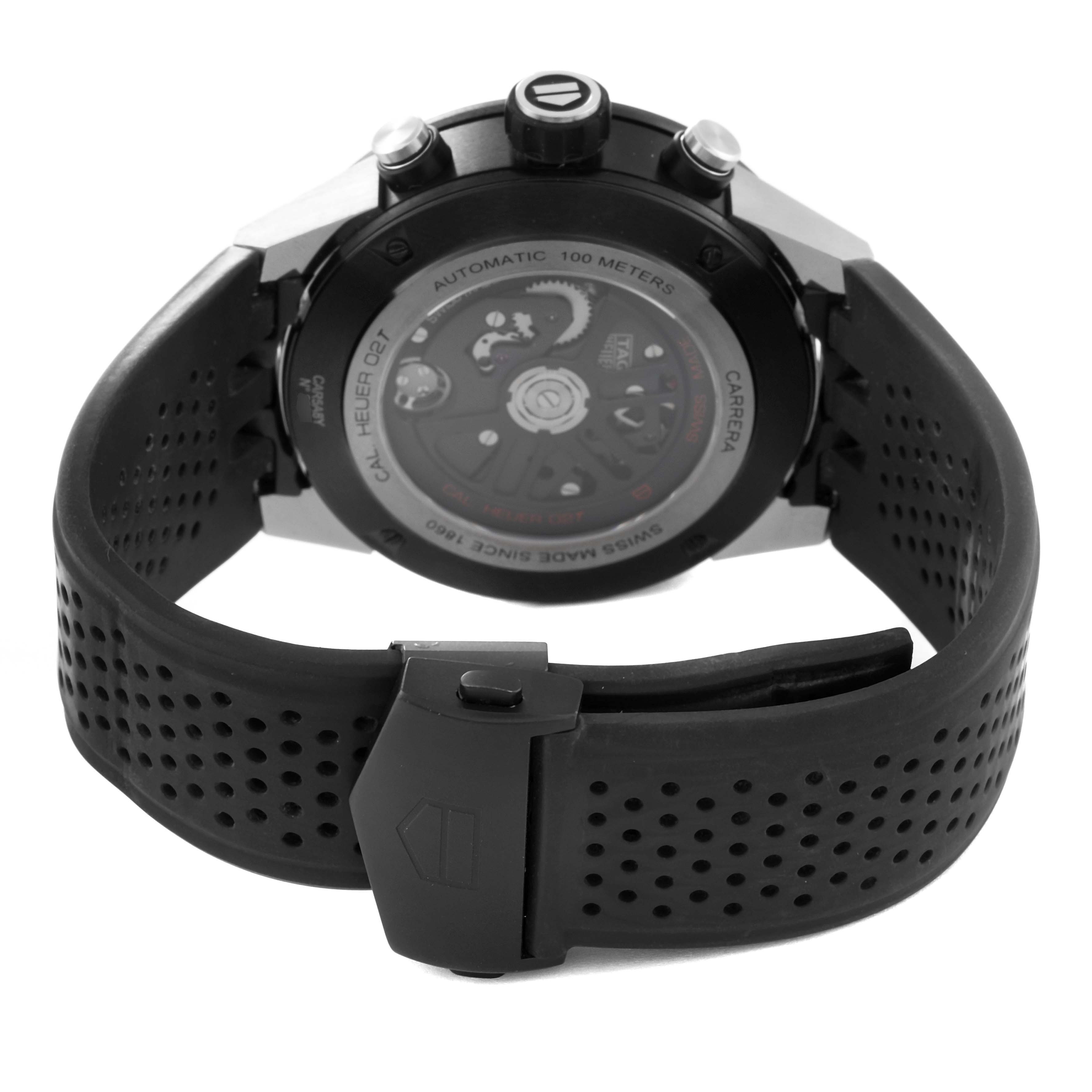 The image shows the back view of a Tag Heuer Carrera CAR5A8Y.FC6377 Men's Titanium Black Dial CAR5A8Y.FC6377 Men's Titanium Black Dial watch, displaying its automatic movement and rubber strap.