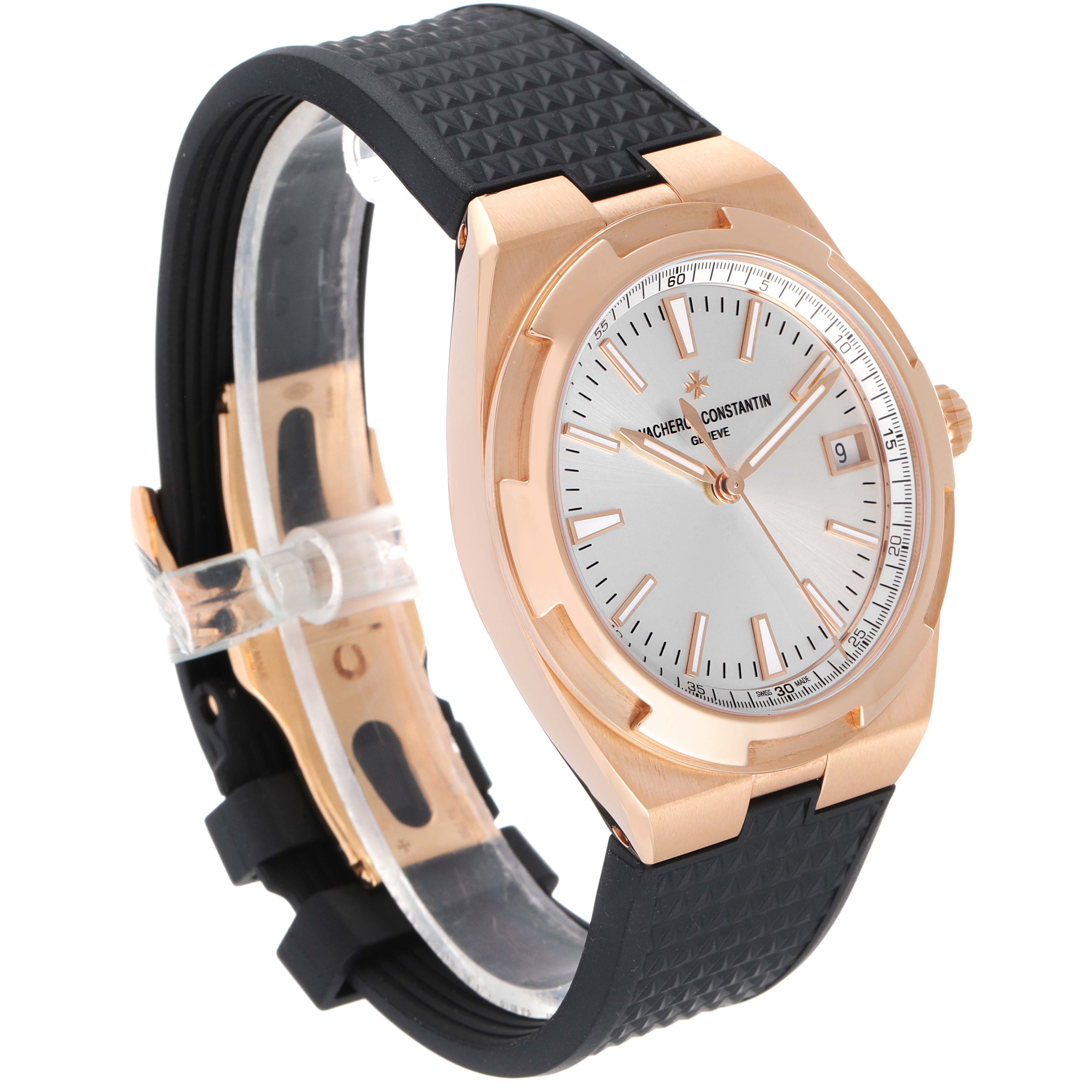 The image shows a Vacheron Constantin Overseas 4500V/000R-B127 Men's Rose Gold Silver Dial 4500V/000R-B127 Men's Rose Gold Silver Dial watch from an angled view, highlighting its gold case, silver dial, and black strap.