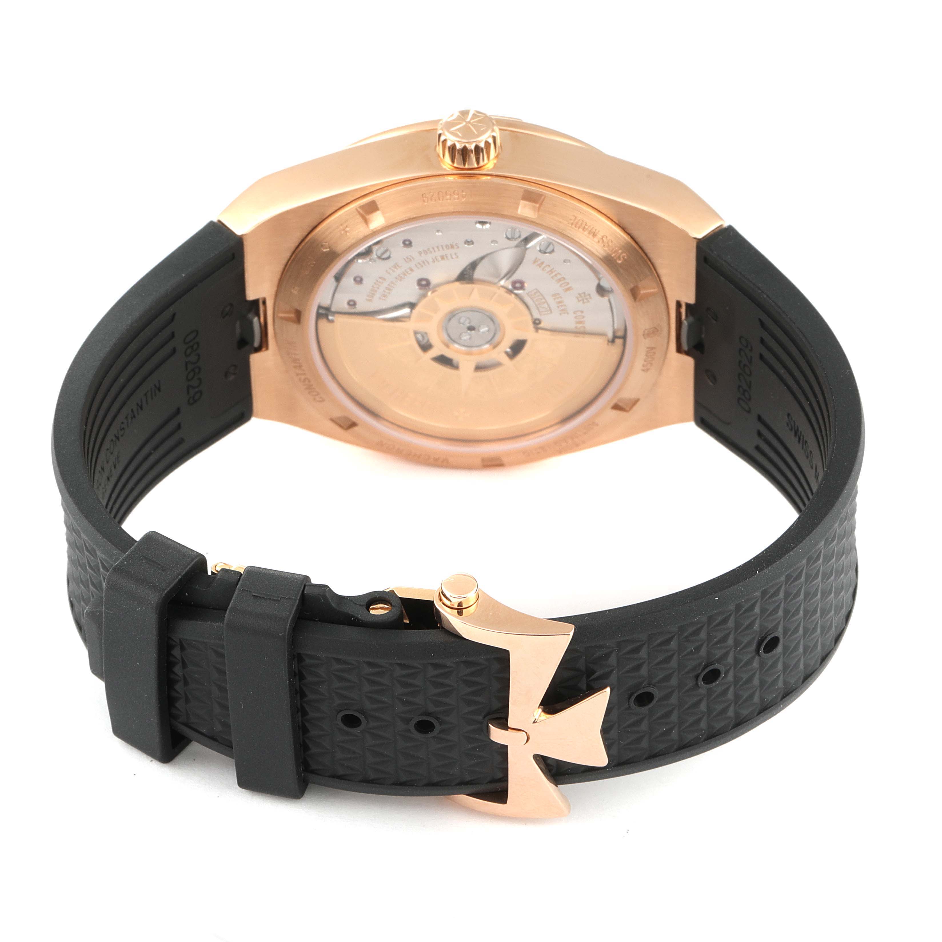 This image shows the case back, movement, crown, and black rubber strap of a Vacheron Constantin Overseas 4500V/000R-B127 Men's Rose Gold Silver Dial 4500V/000R-B127 Men's Rose Gold Silver Dial watch.