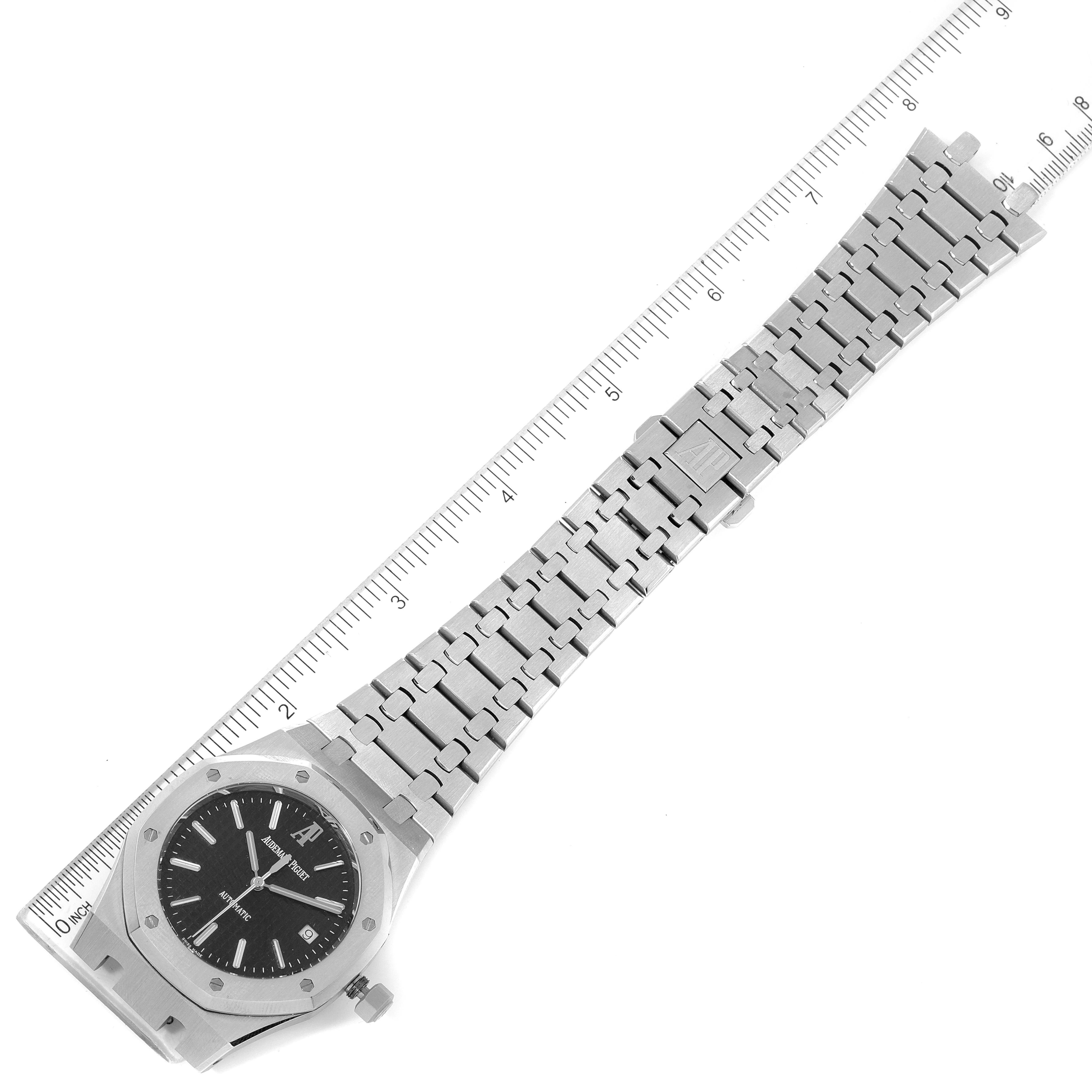 The image shows an Audemars Piguet Royal Oak 15300ST.OO.1220ST.03 Men's Stainless Steel Black Dial 15300ST.OO.1220ST.03 Men's Stainless Steel Black Dial watch laid flat with a ruler measuring its length.
