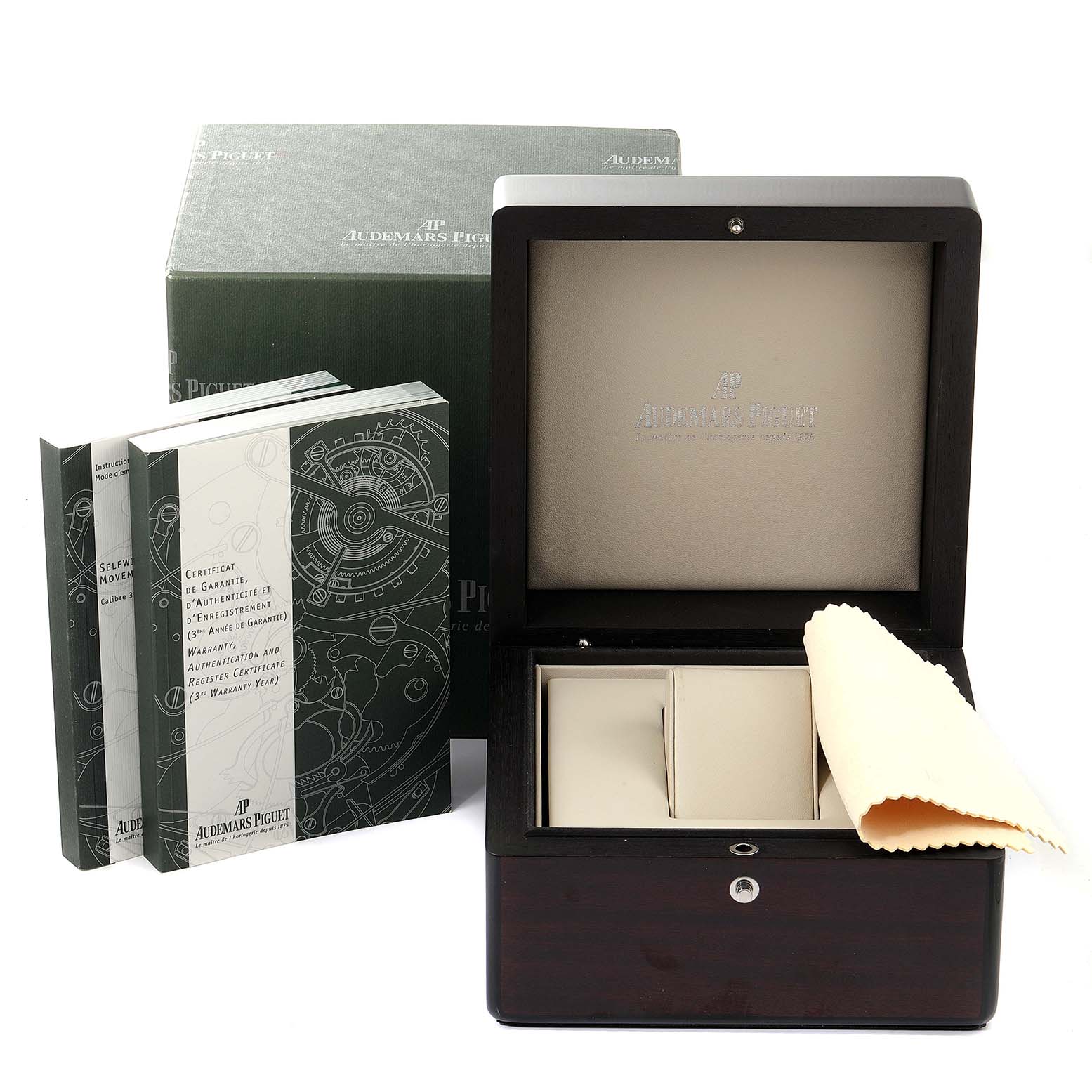 The image shows a watch box, booklets, and a cloth for the Royal Oak model by Audemars Piguet.