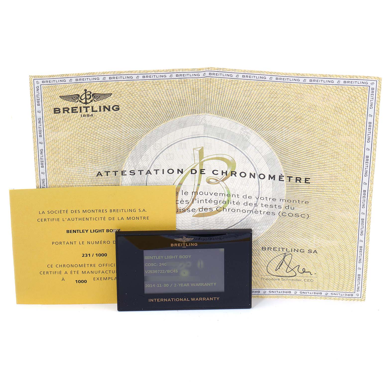 The image shows Breitling Bentley V25367 Men's Titanium Black Dial V25367 Men's Titanium Black Dial model watch accessories, including an attestation of chronometer, a certificate of authenticity, and an international warranty card.