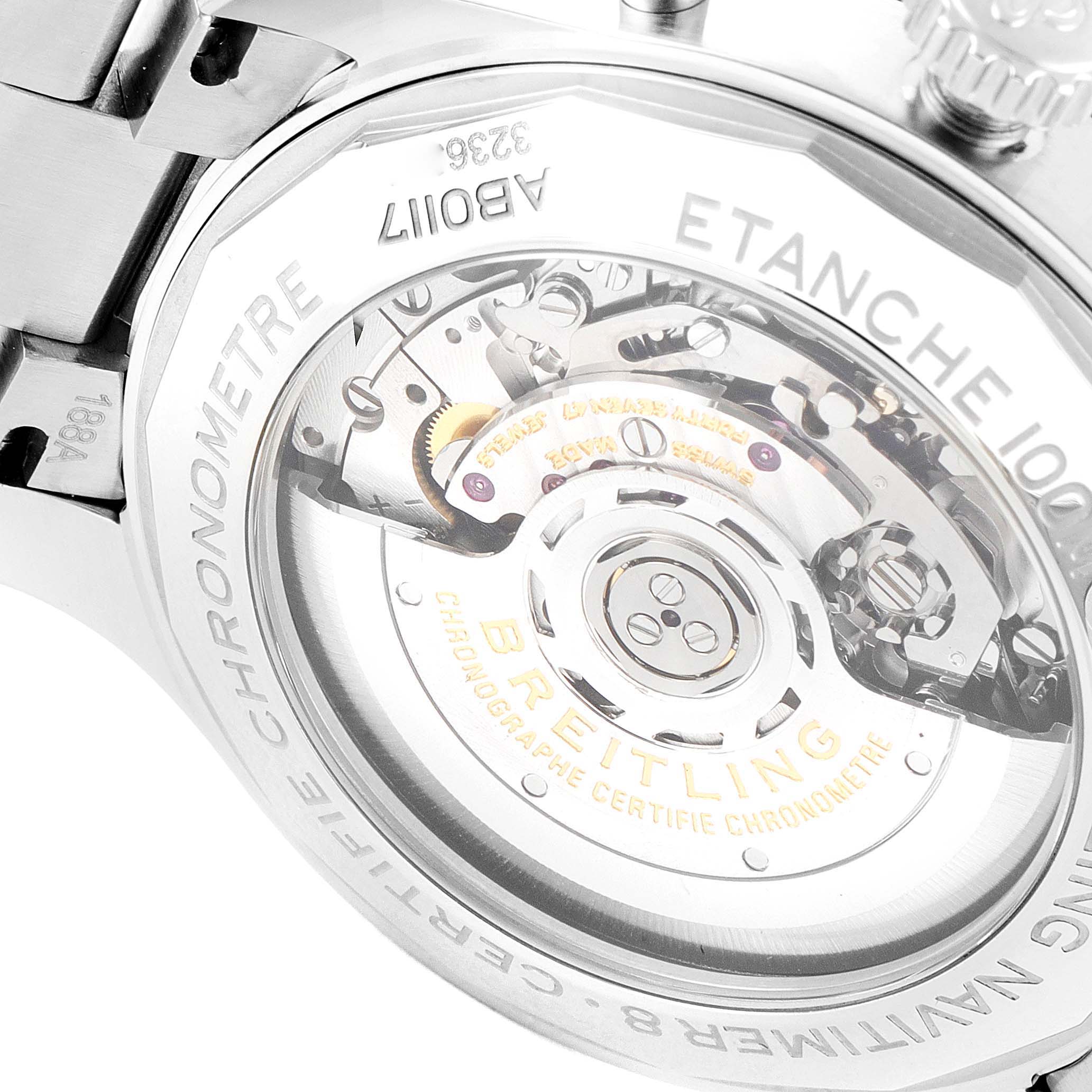 The image shows the back view of the Breitling Navitimer, focusing on its visible mechanical movement.