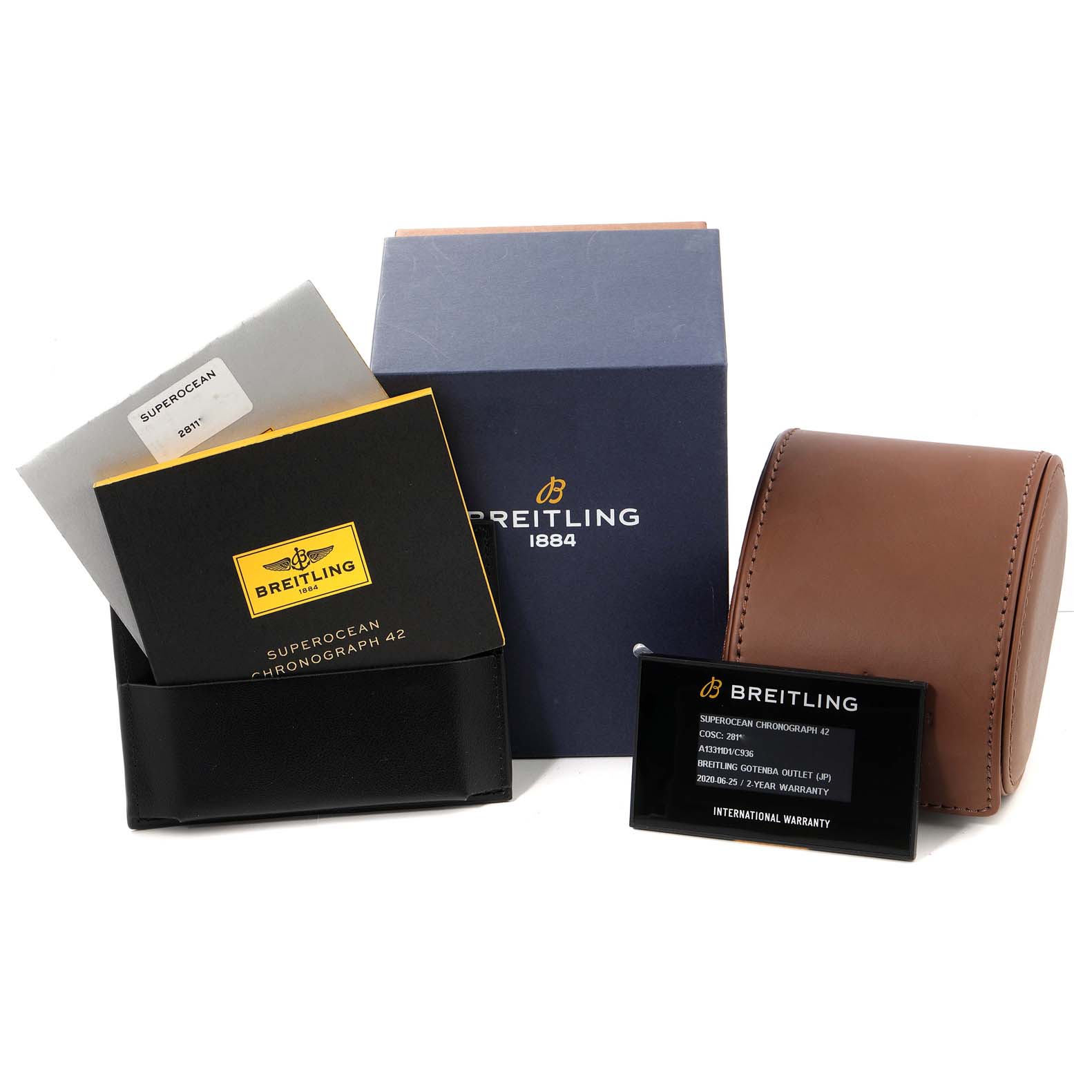 The image shows the Superocean model by Breitling with its packaging, warranty card, instruction manual, and brown watch case.