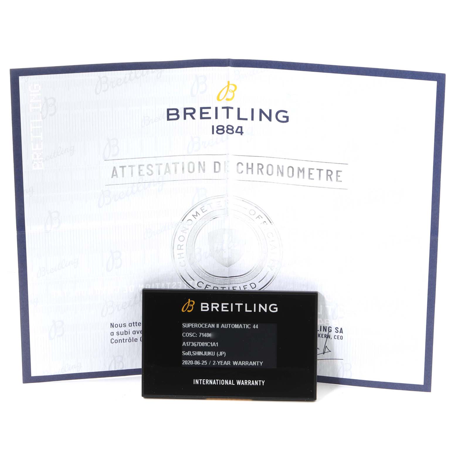 The image shows a Breitling Superocean A17367 Men's Stainless Steel Blue Dial A17367 Men's Stainless Steel Blue Dial model warranty card and certificate, taken from a front angle.