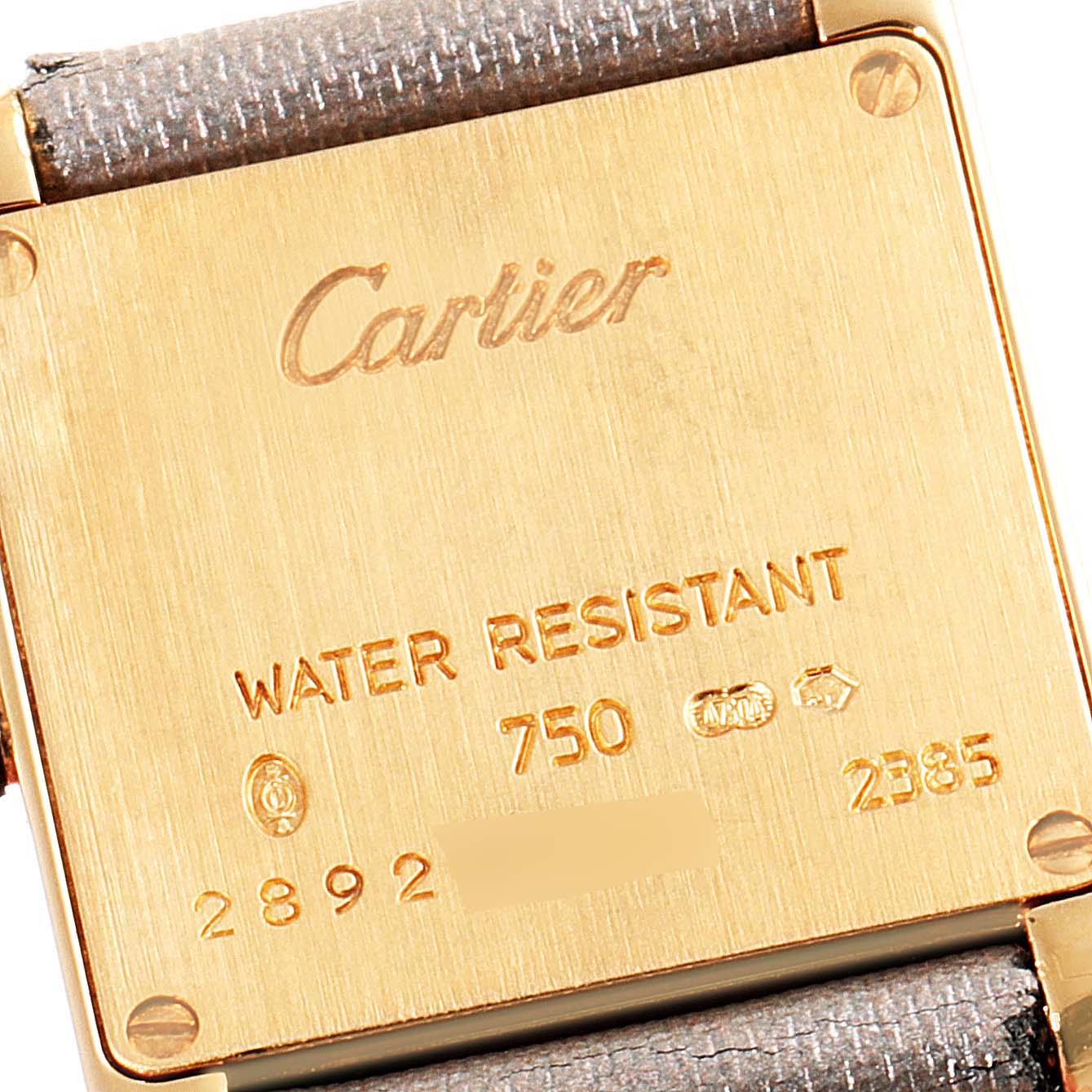 The image shows the back case of a Cartier Tank Française watch, highlighting its inscriptions and water resistance.