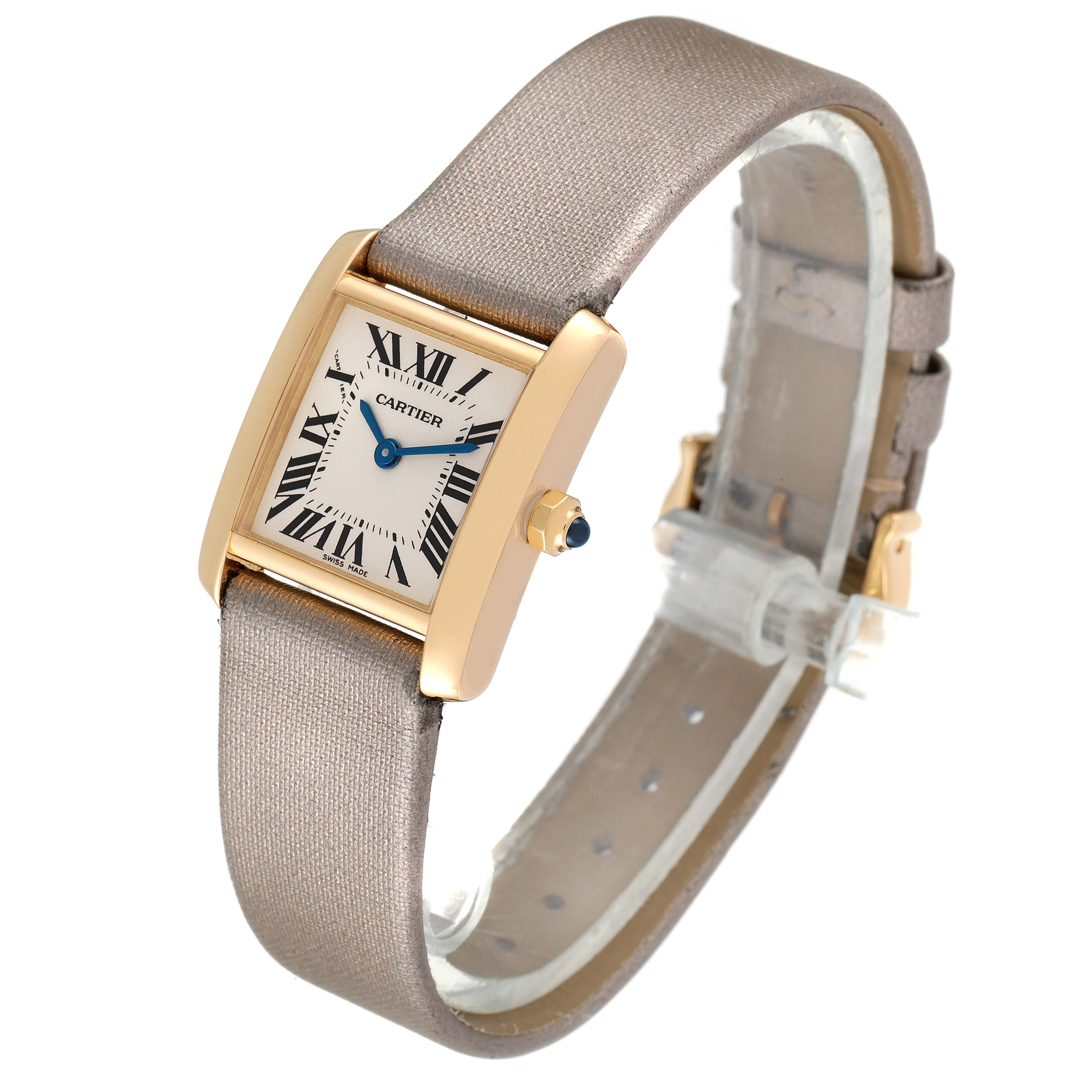 The image shows a Cartier Tank Francaise W5000256 Women
s Yellow Gold Silver Dial W5000256 Women
s Yellow Gold Silver Dial watch at a three-quarter angle, displaying its face, strap, and side view with the crown.