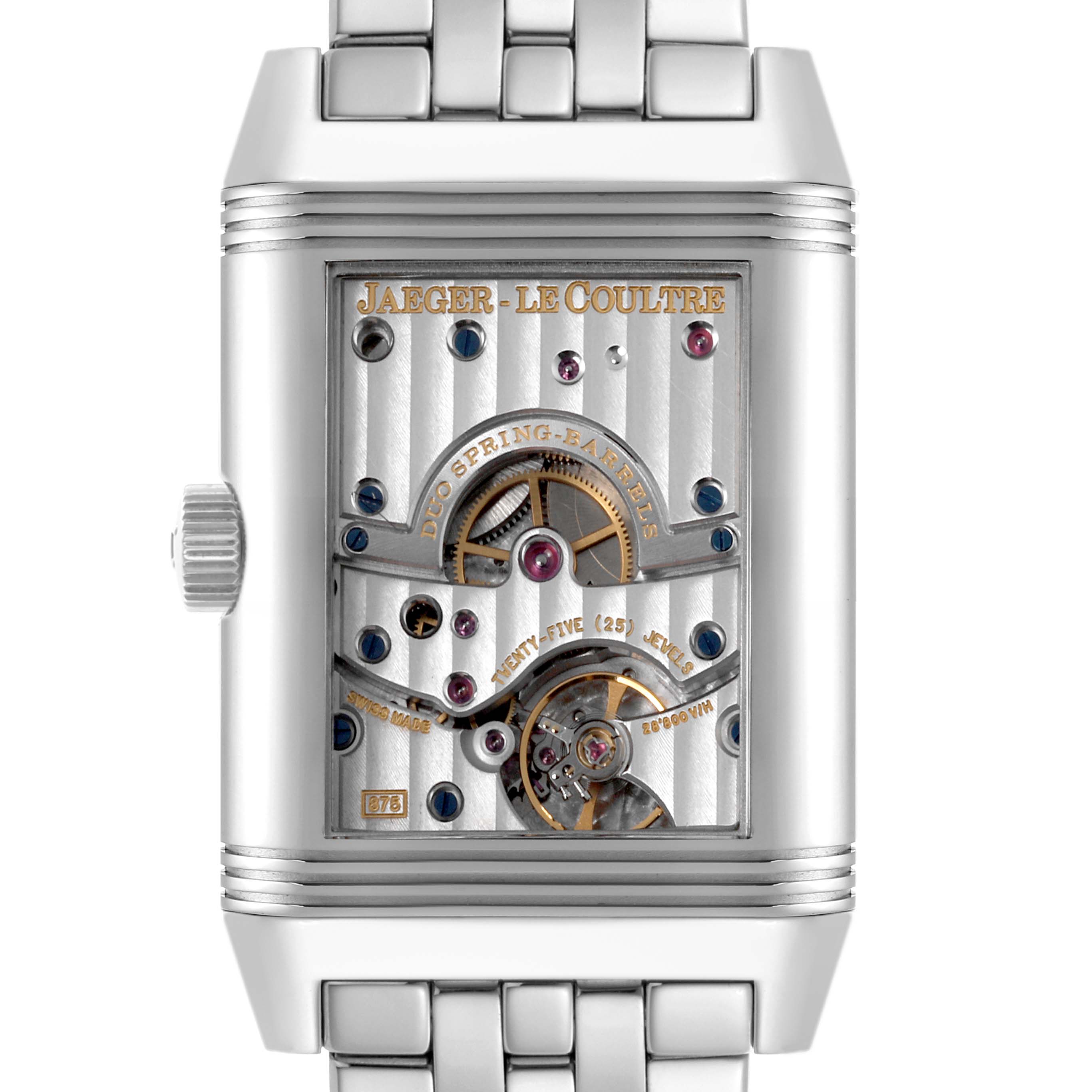 The Jaeger-LeCoultre Reverso watch is shown from the back, displaying its intricate movement with visible gears and components.