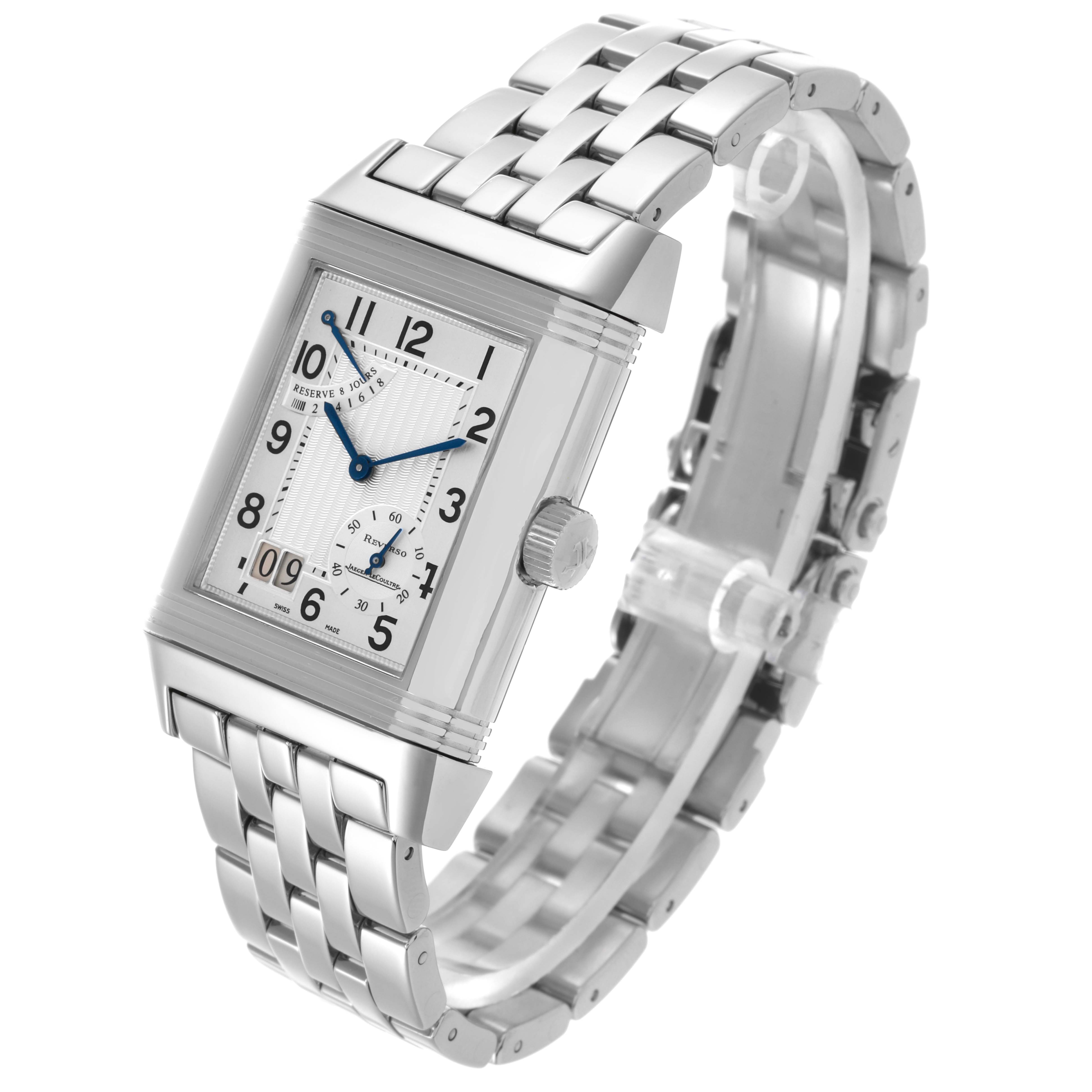 The Jaeger-LeCoultre Reverso watch is shown at an angled side view, displaying its rectangular face and metal bracelet.