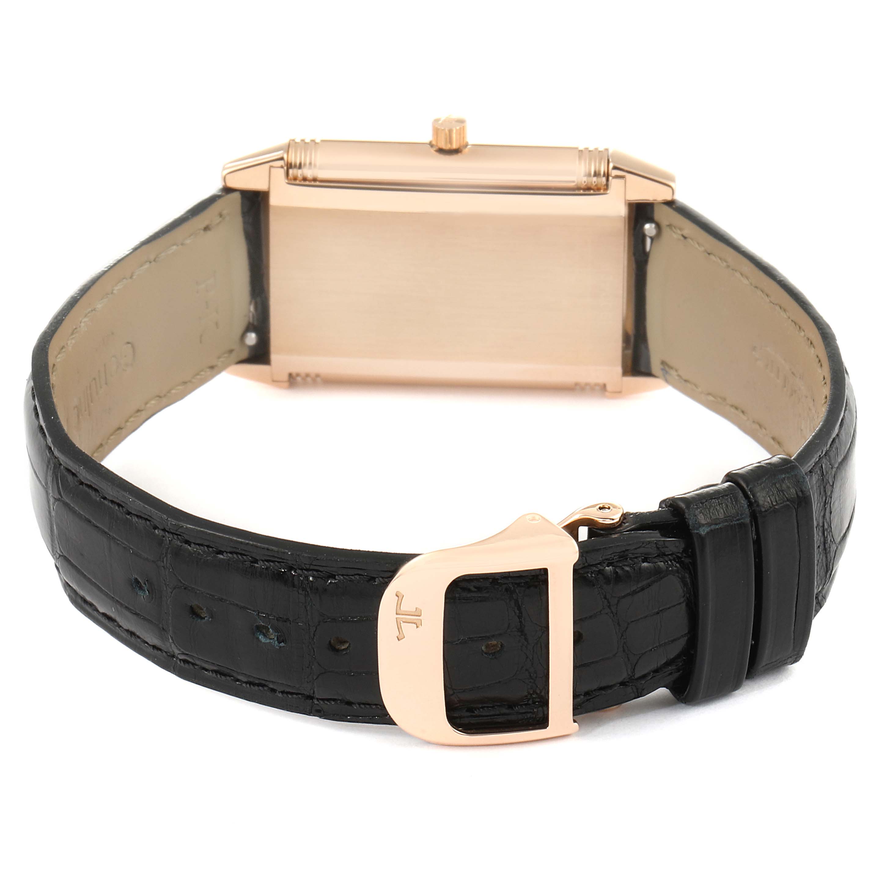 This image shows the back of a Jaeger-LeCoultre Reverso watch with a black leather strap and gold buckle.