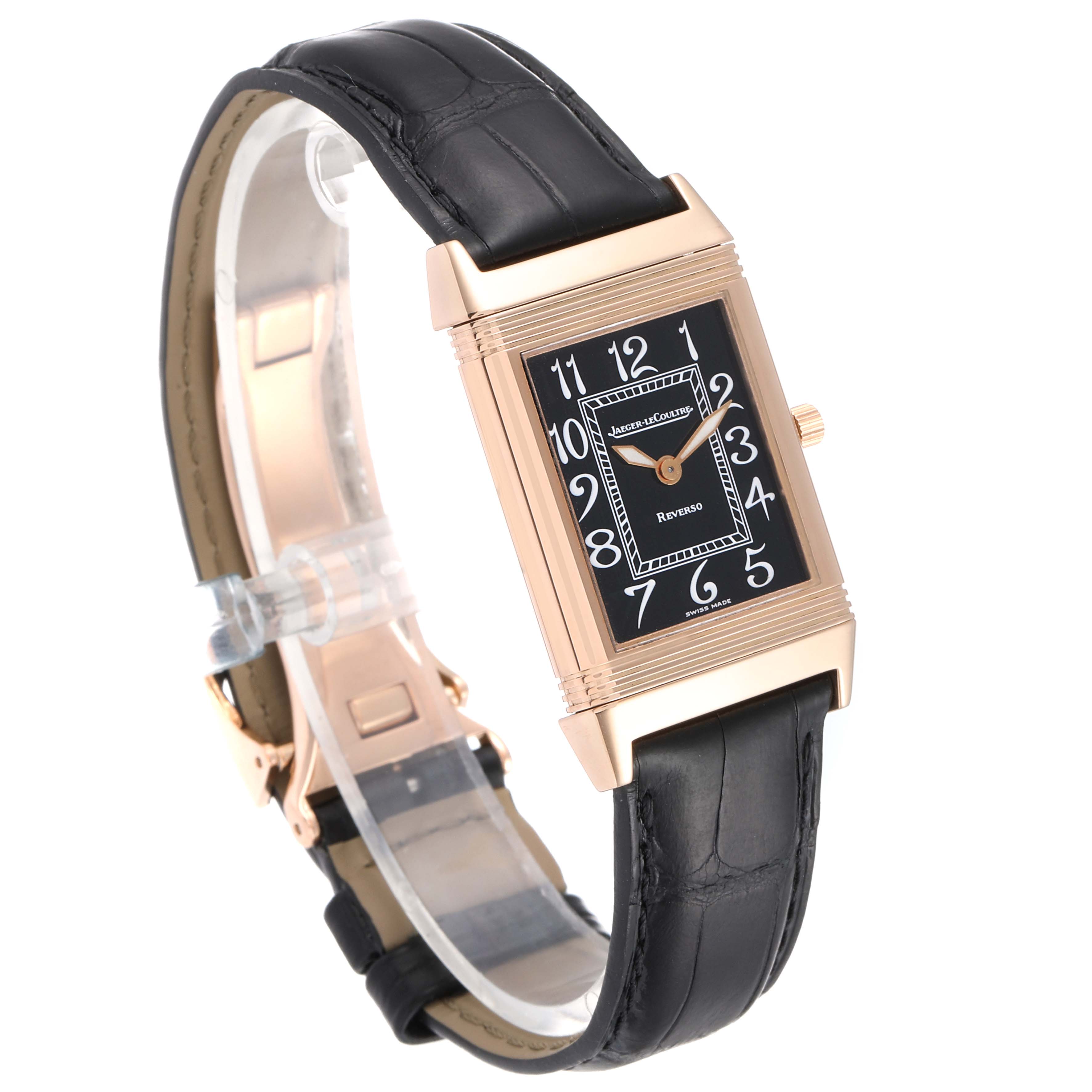 The Jaeger-LeCoultre Reverso watch is shown at a side angle, highlighting its rectangular face and black leather strap.