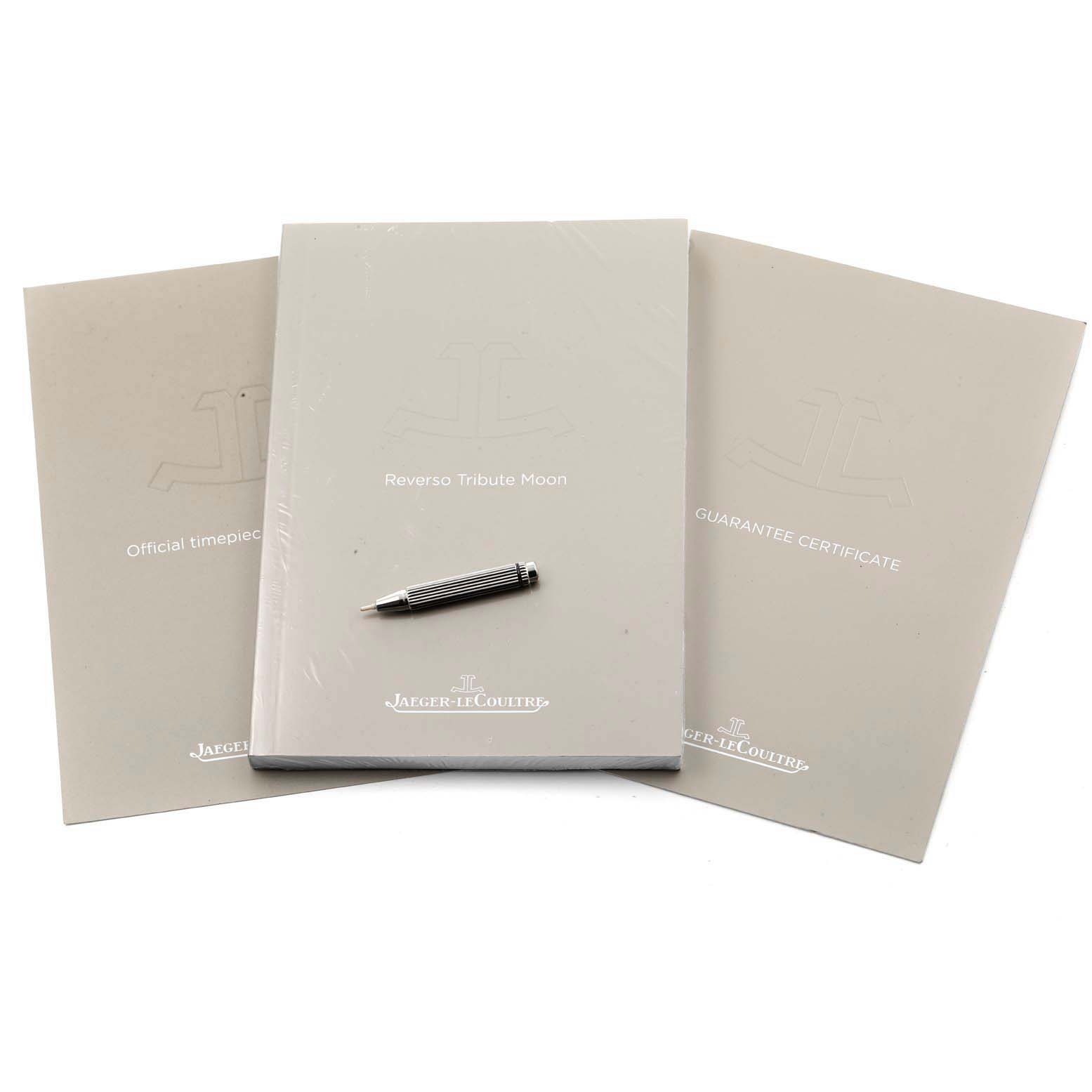 This image shows the Jaeger LeCoultre Reverso Q3958420 Men's Stainless Steel Blue Dial Q3958420 Men's Stainless Steel Blue Dial model's booklets and a tool pen from a top-down angle.