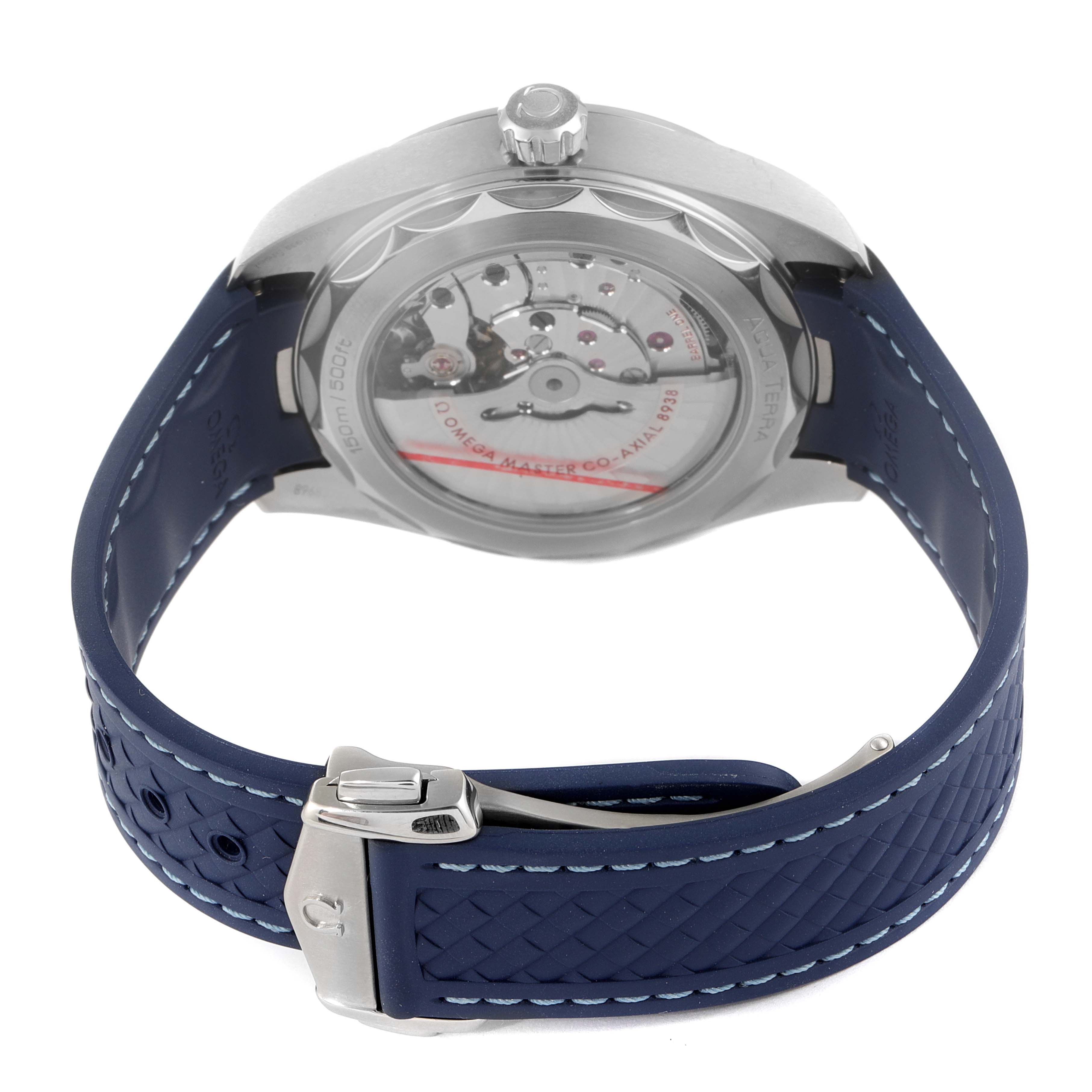 The image shows the back view of the Omega Aqua Terra 220.12.43.22.03.001 Men's Stainless Steel Blue Dial 220.12.43.22.03.001 Men's Stainless Steel Blue Dial watch, highlighting the exhibition case back and movement, with a blue rubber strap and clasp.