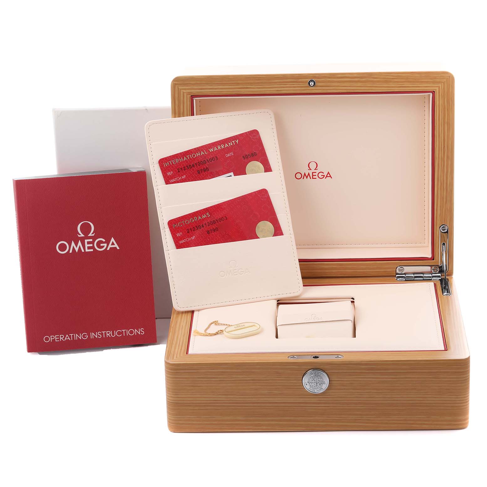 The Omega Seamaster 212.30.41.20.01.003 Men
s Stainless Steel Black Dial 212.30.41.20.01.003 Men
s Stainless Steel Black Dial box is open, displaying warranty cards, a booklet, and watch accessories.