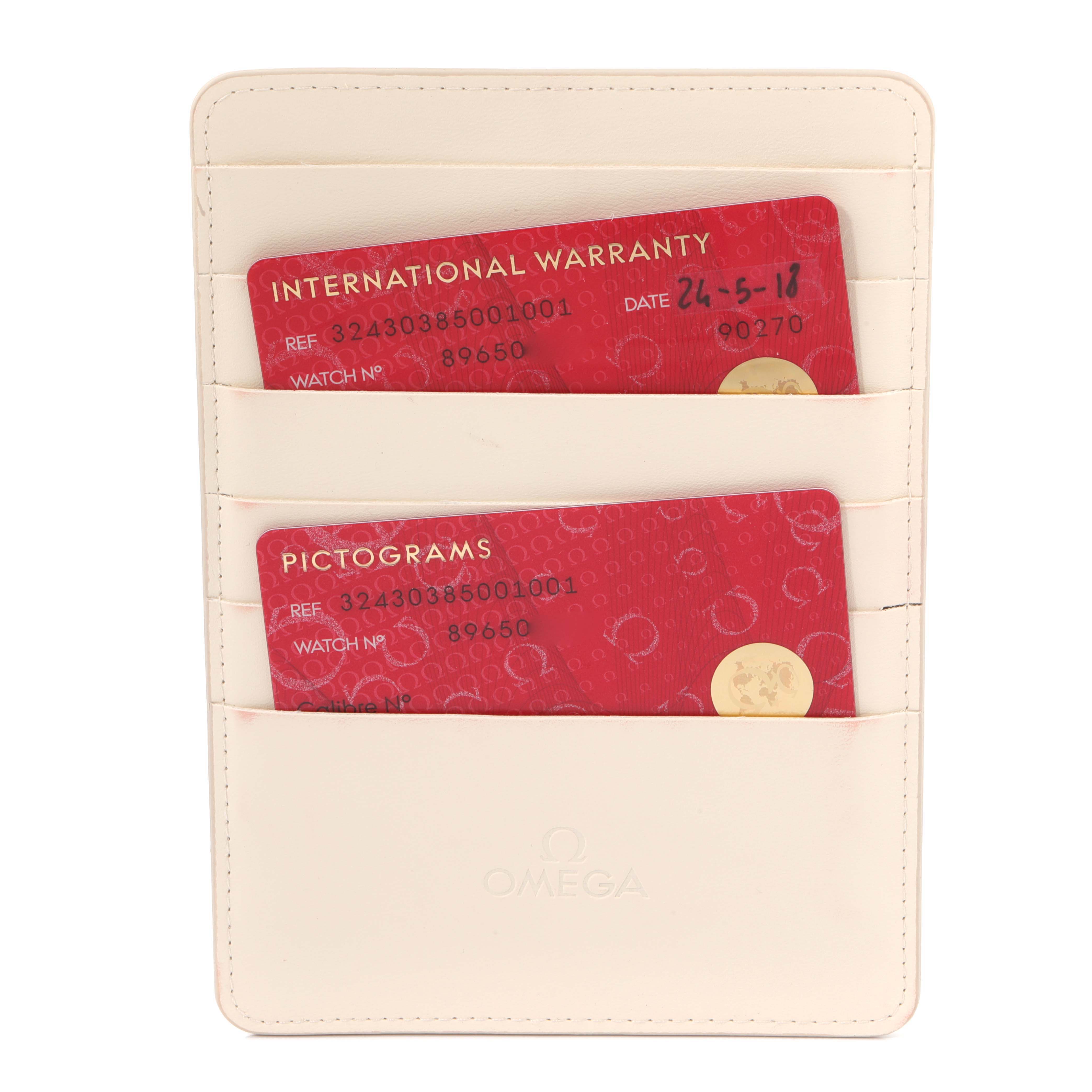 The image shows an Omega Speedmaster 324.30.38.50.01.001 Men
s Stainless Steel Black Dial 324.30.38.50.01.001 Men
s Stainless Steel Black Dial watch accessory with warranty and pictogram cards in a cream card holder.