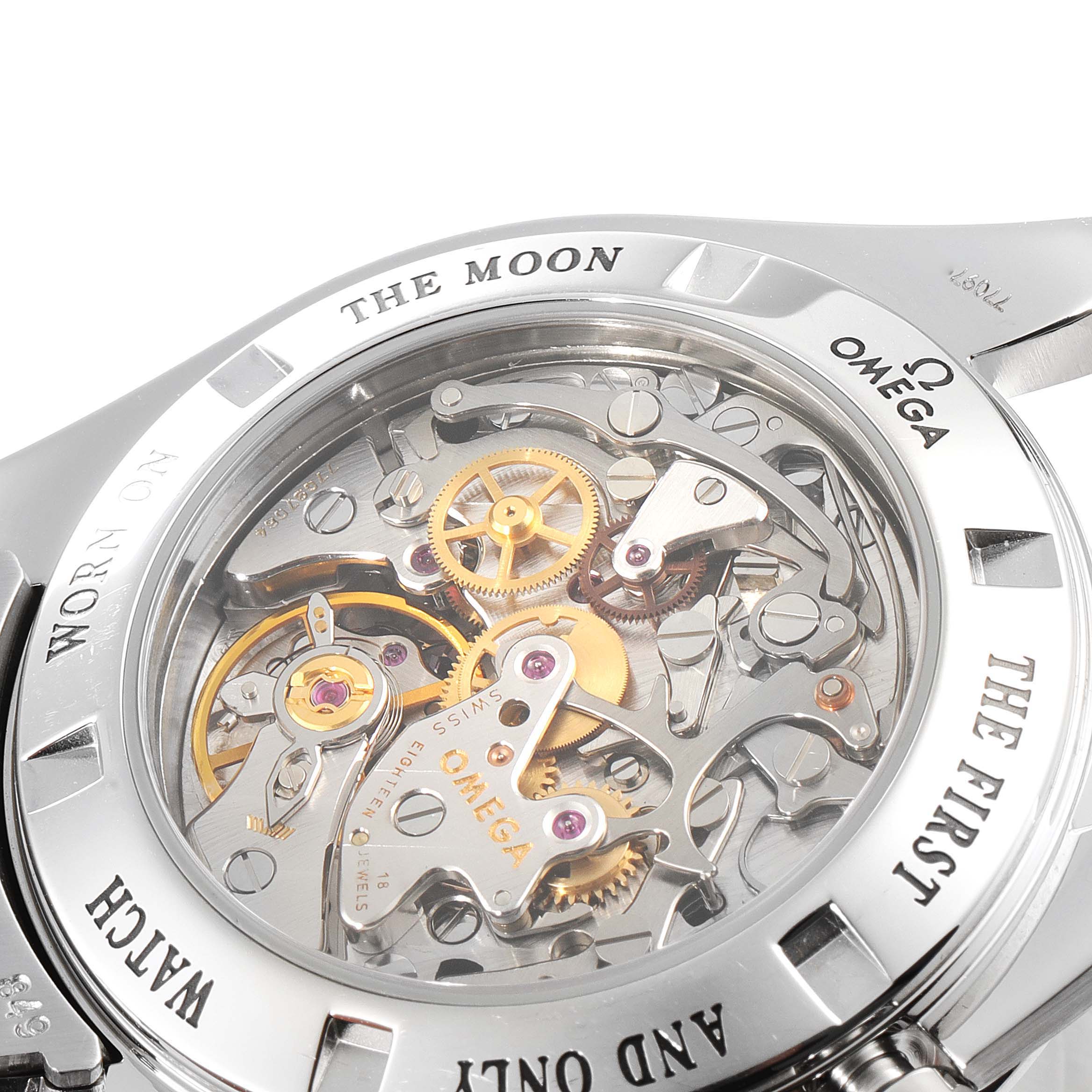 The image shows the back view of an Omega Speedmaster 3573.50.00 Men
s Stainless Steel Black Dial 3573.50.00 Men
s Stainless Steel Black Dial watch, highlighting its intricate inner mechanisms and gears.