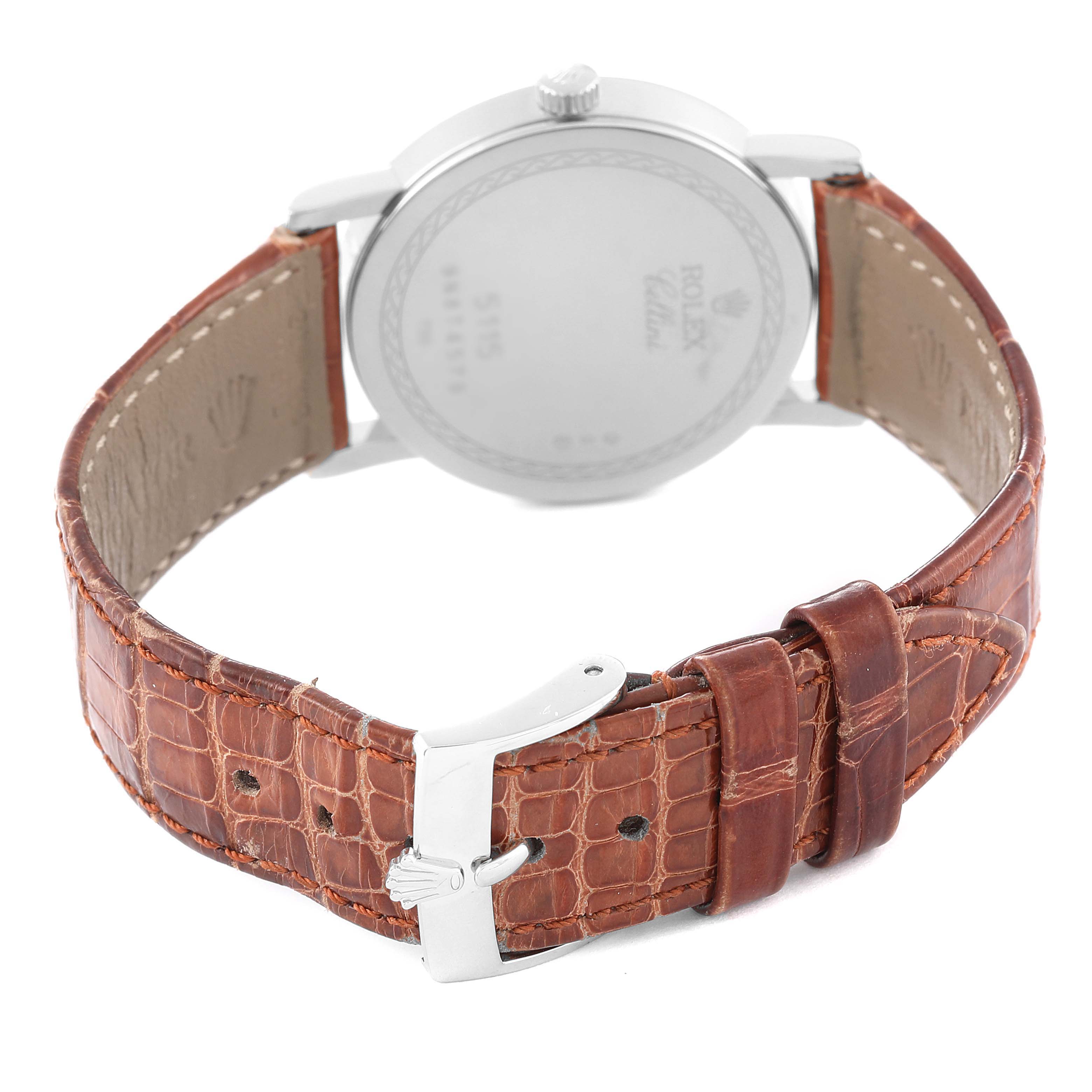 The image shows the back view of a Rolex Cellini 5115/9 Men's White Gold Beige Dial 5115/9 Men's White Gold Beige Dial watch, highlighting its leather strap and buckle.