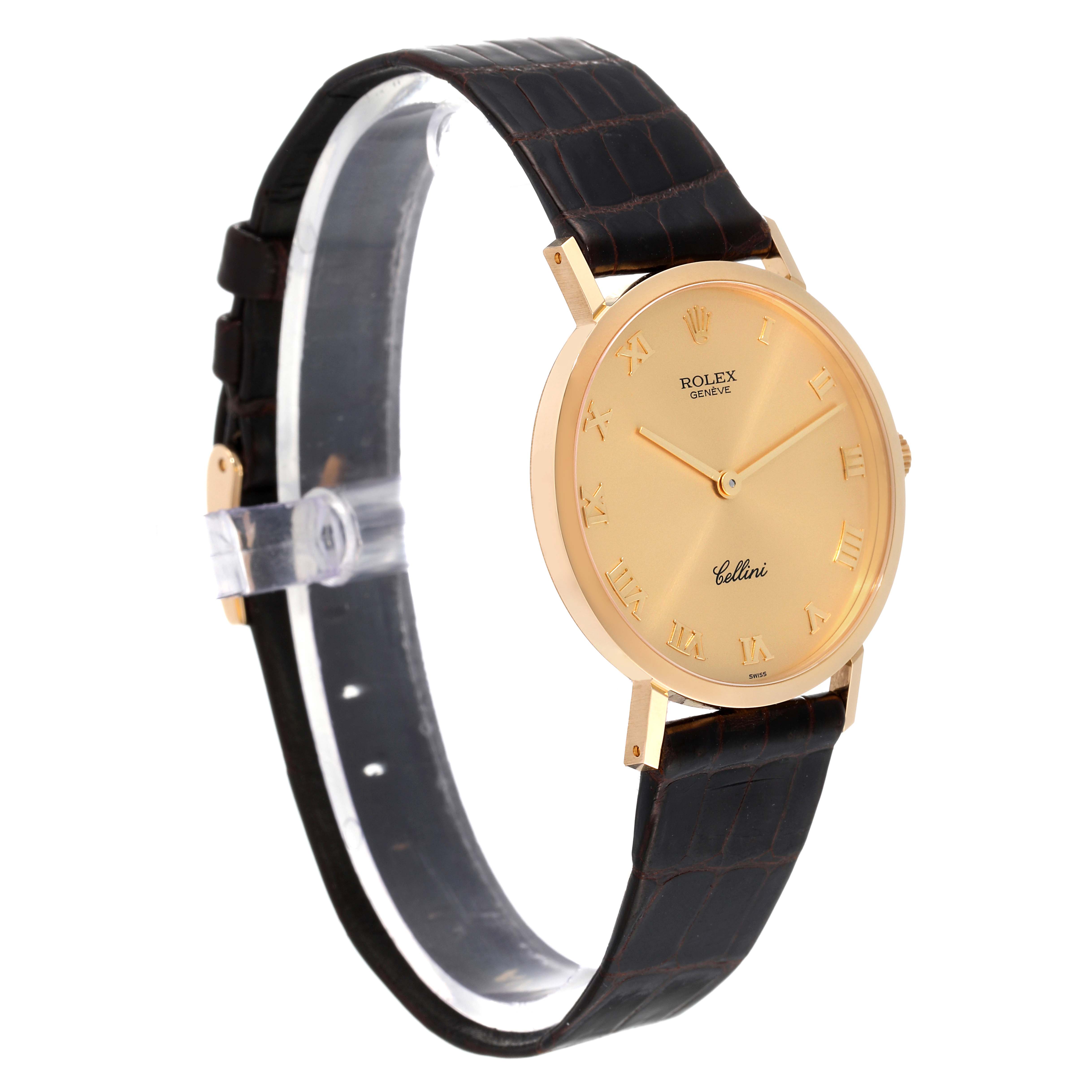 The image shows a Rolex Cellini 4112 Men
s Yellow Gold Champagne Dial 4112 Men
s Yellow Gold Champagne Dial watch angled slightly to the left, showcasing its gold face, Roman numerals, and black leather strap.