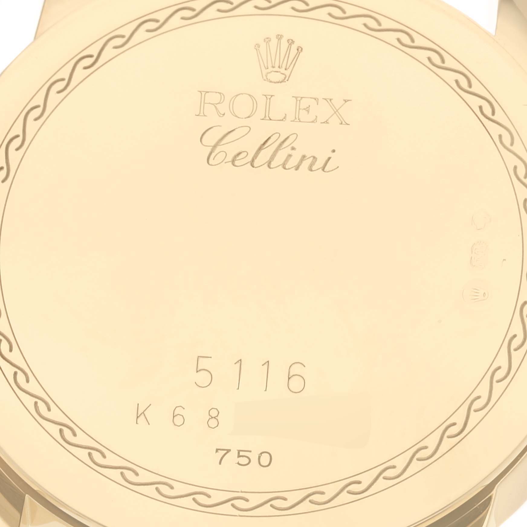 The image shows the back case of a Rolex Cellini 5116/8 Men's Yellow Gold White Dial 5116/8 Men's Yellow Gold White Dial watch, featuring model engravings and a decorative border.