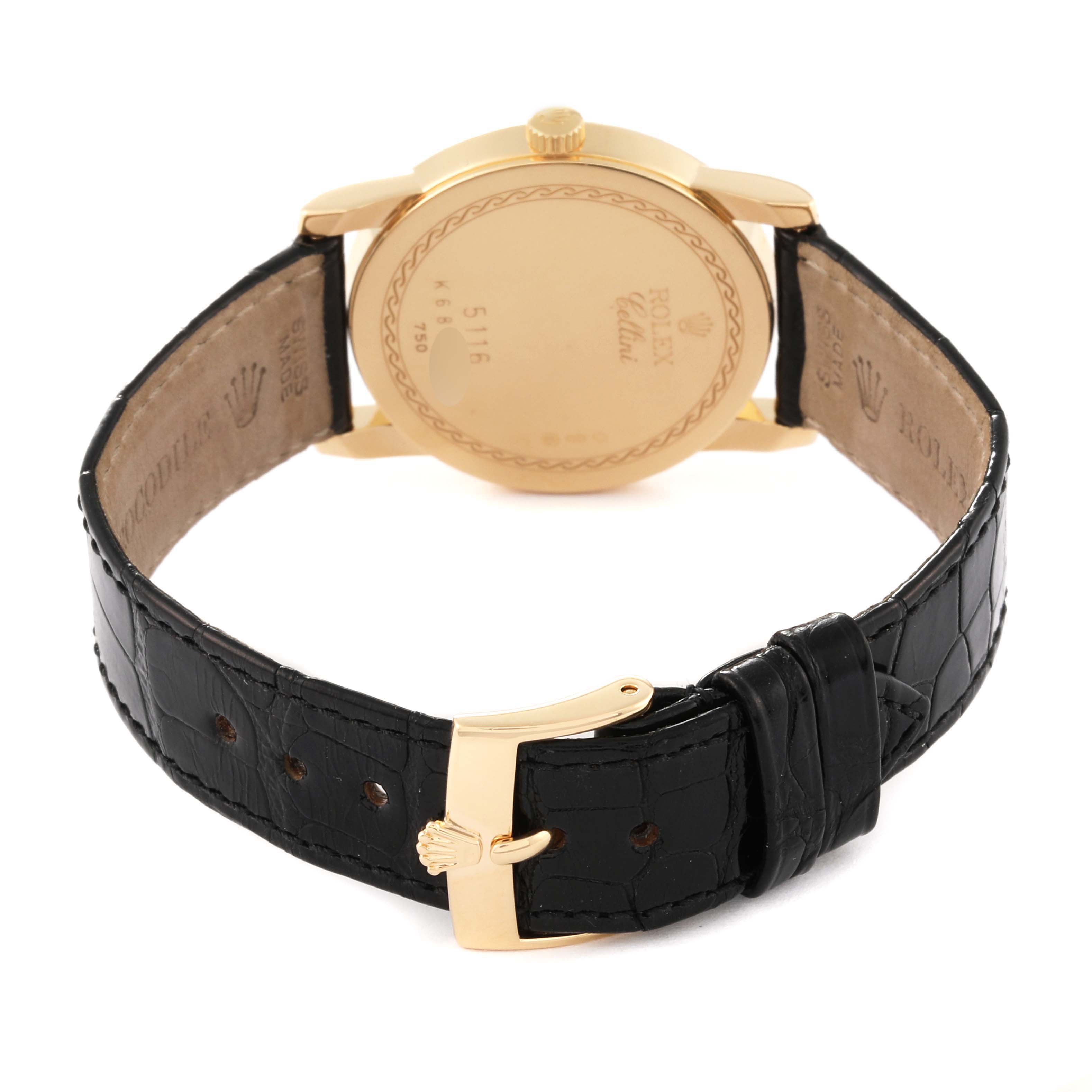 The image shows a rear view of the Rolex Cellini 5116/8 Men's Yellow Gold White Dial 5116/8 Men's Yellow Gold White Dial watch, highlighting the back case and the black leather strap with a gold buckle.