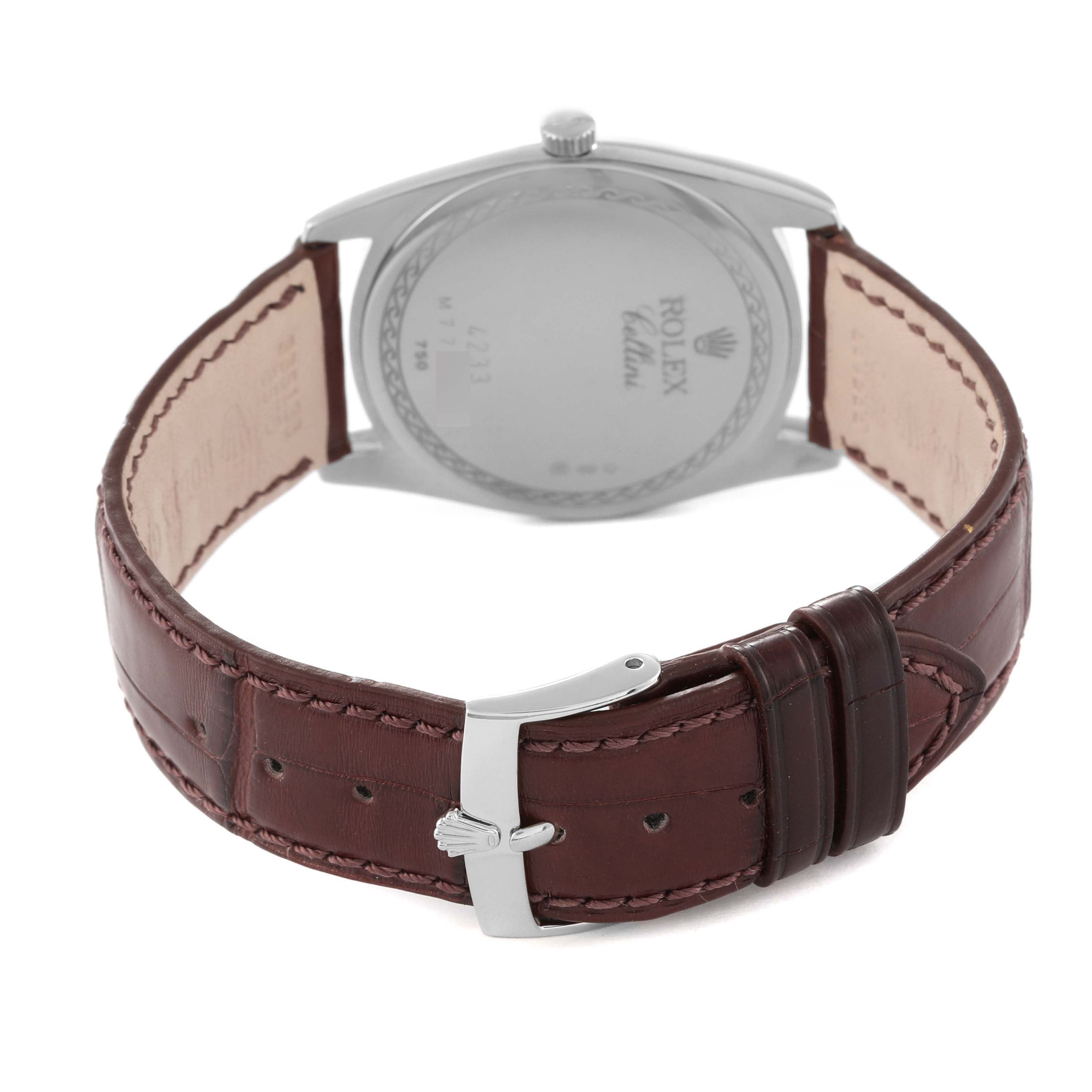 The image shows a rear view of a Rolex Cellini 4233 Men's White Gold Black Dial 4233 Men's White Gold Black Dial watch, highlighting the back case and brown leather strap with the buckle.