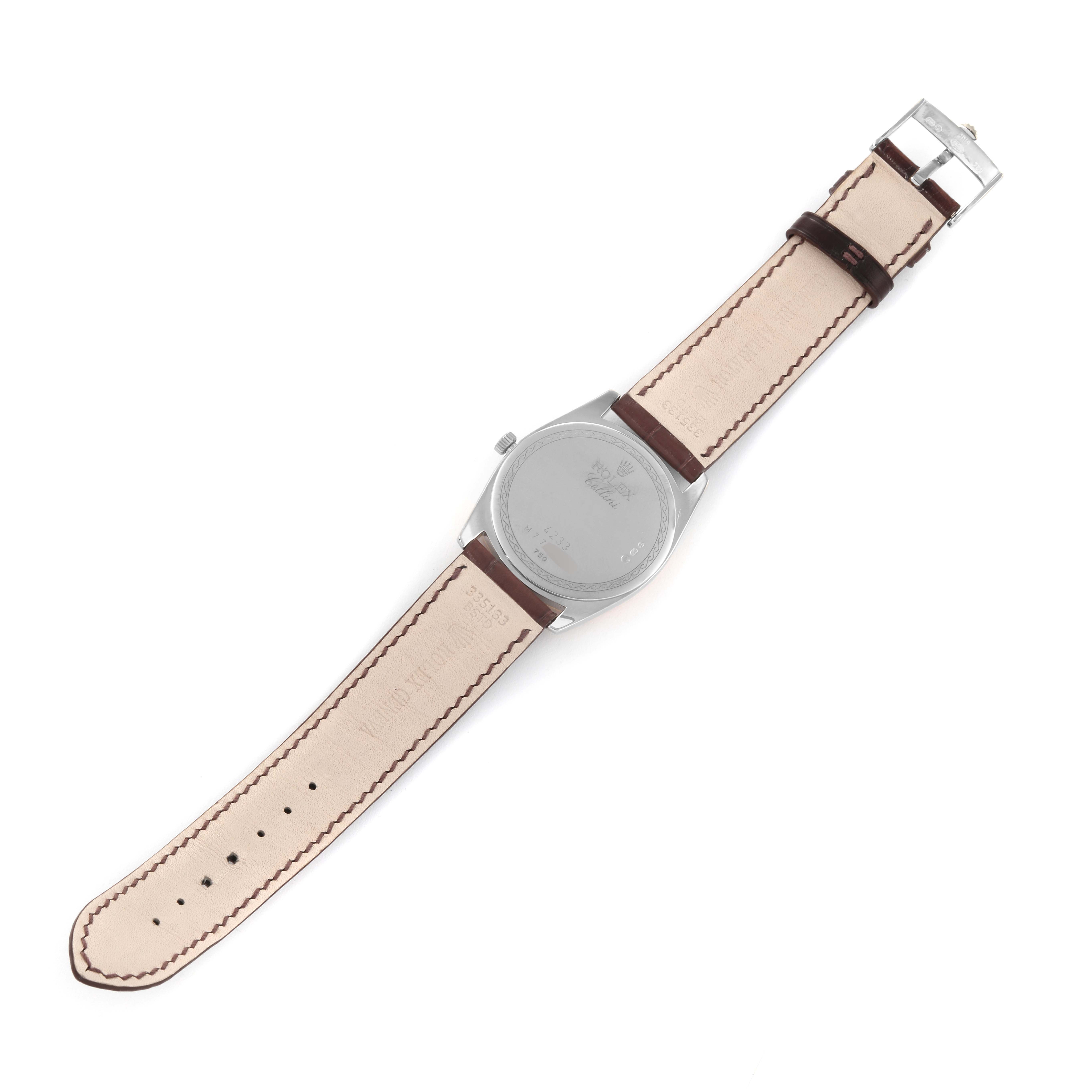 The image shows the back of a Rolex Cellini 4233 Men's White Gold Black Dial 4233 Men's White Gold Black Dial watch, including its leather band and metal buckle, from a top-down angle.