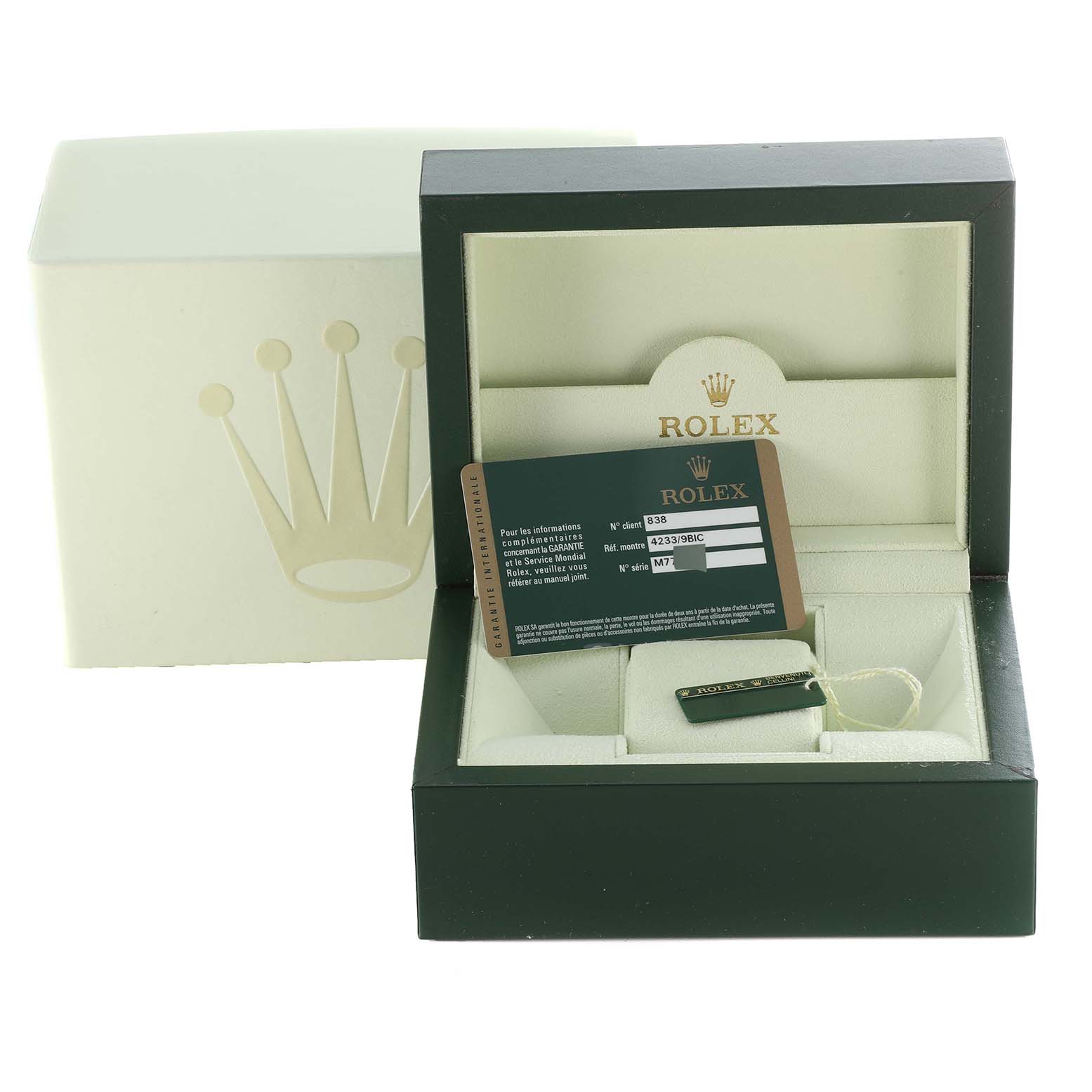 The image shows a Rolex Cellini 4233 Men's White Gold Black Dial 4233 Men's White Gold Black Dial watch box with an open lid, displaying the warranty card and tag.