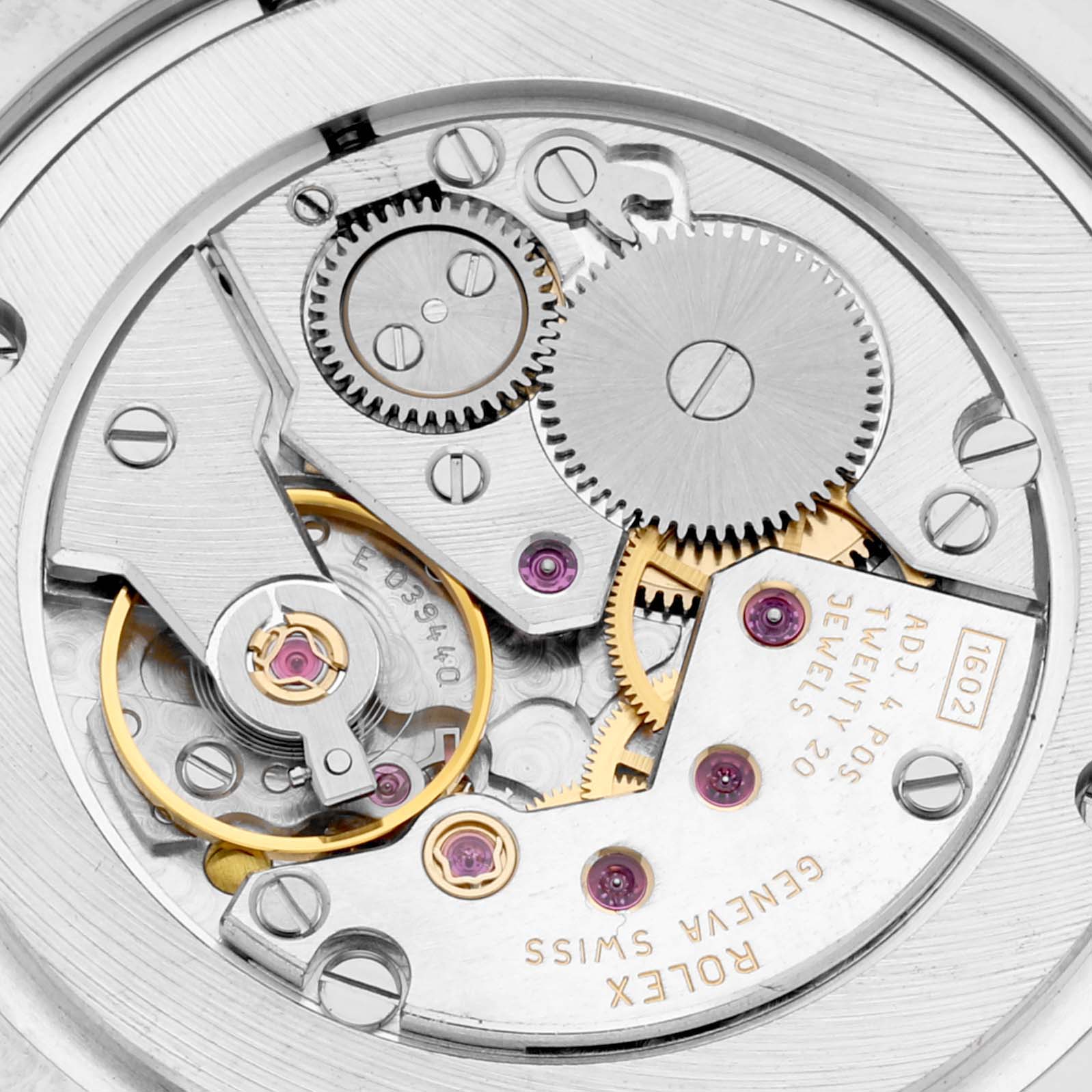 The image shows the internal mechanism of a Rolex Cellini 4233 Men's White Gold Black Dial 4233 Men's White Gold Black Dial watch, viewed from the back, highlighting gears and jewels.