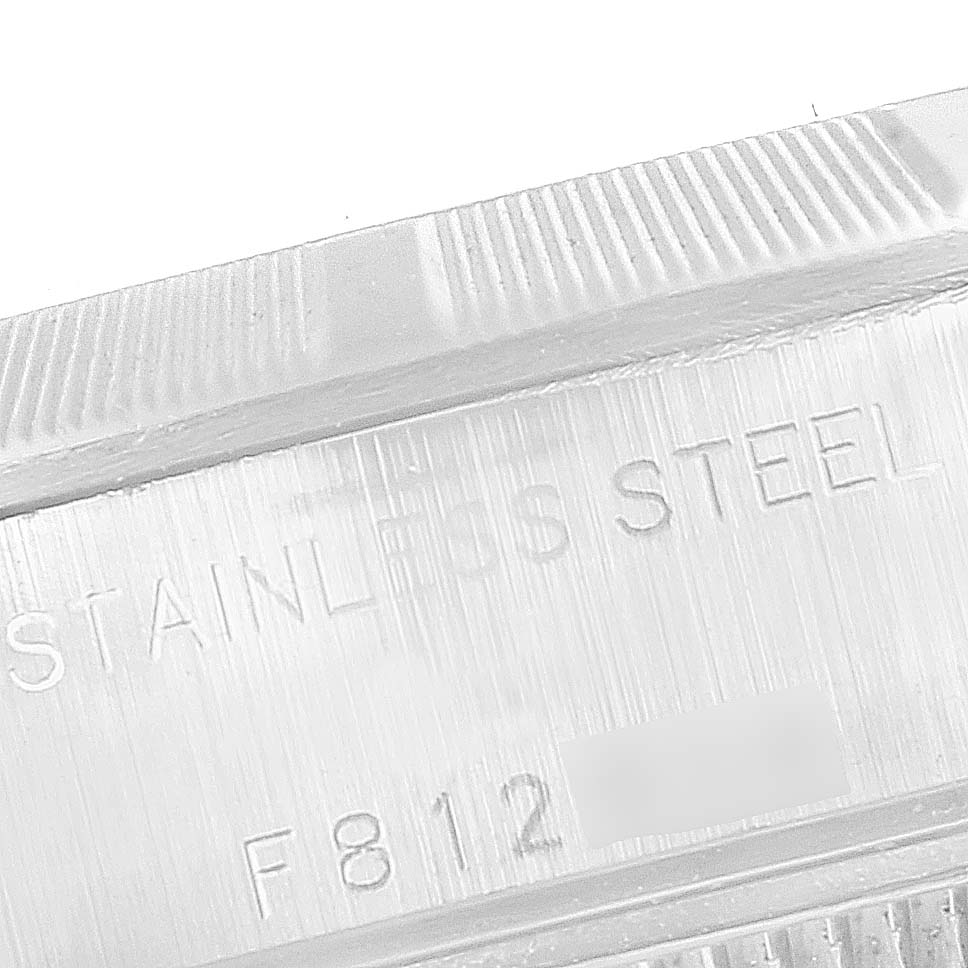 This image shows a close-up of the stainless steel case with engravings of a Rolex Date 79190 Women's Stainless Steel Black Dial 79190 Women's Stainless Steel Black Dial model watch.