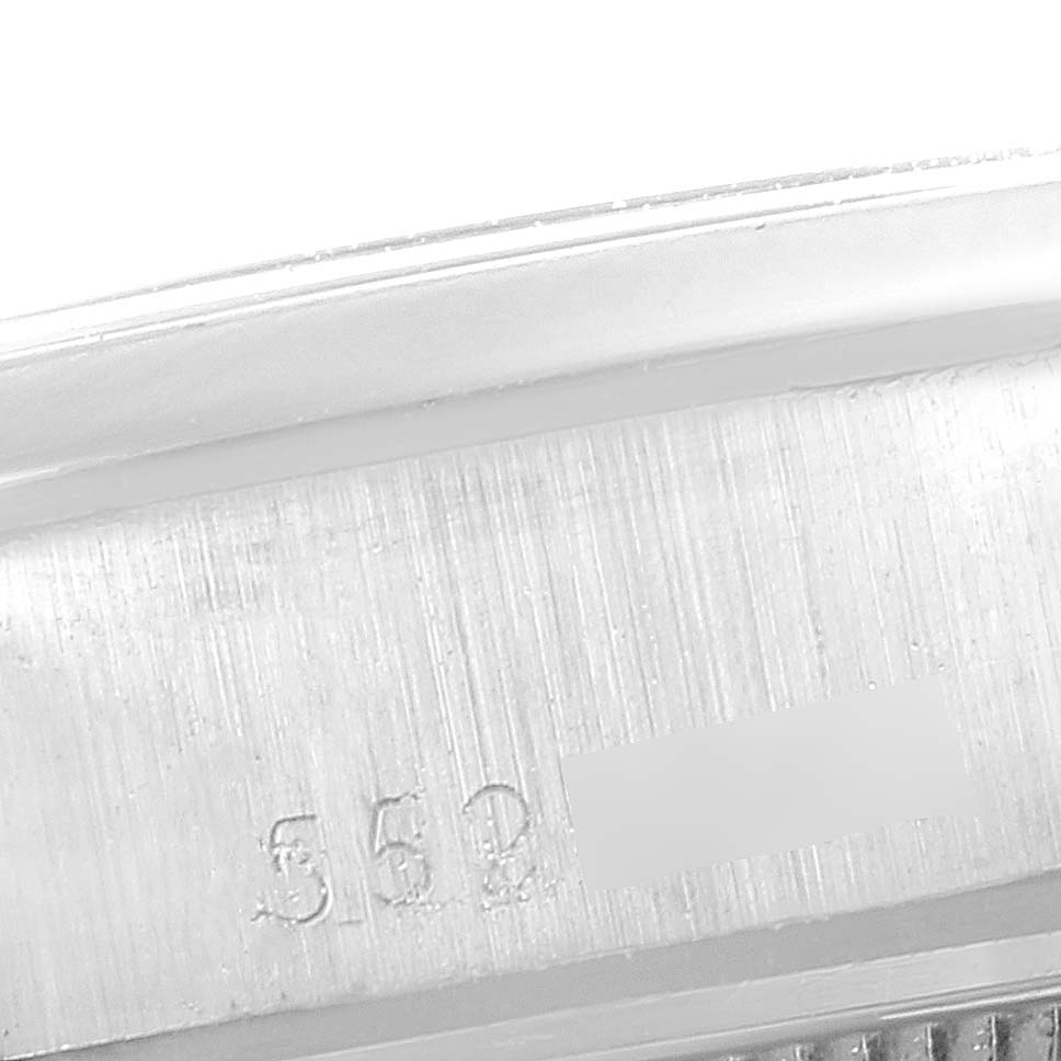 This close-up image shows the serial number area on the case of a Rolex Date 6916 Women's Stainless Steel Blue Dial 6916 Women's Stainless Steel Blue Dial model watch.