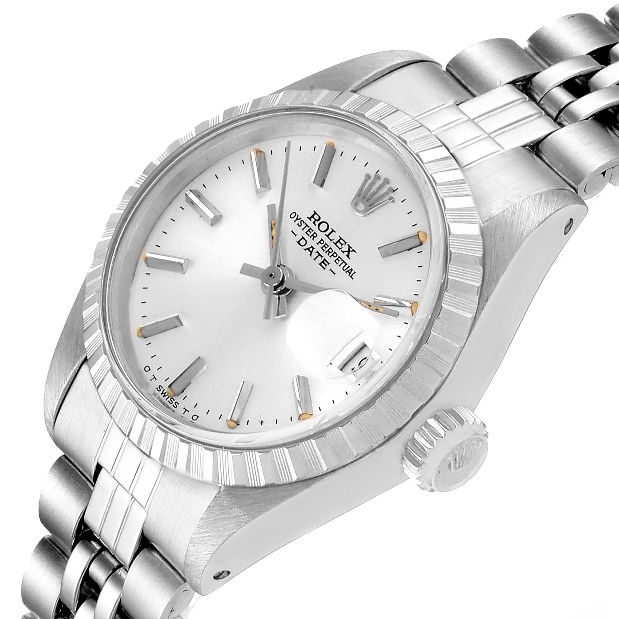This image shows a Rolex Date 6924 Women's Stainless Steel Silver Dial 6924 Women's Stainless Steel Silver Dial model watch from an angled close-up, highlighting the dial, bezel, crown, and part of the bracelet.