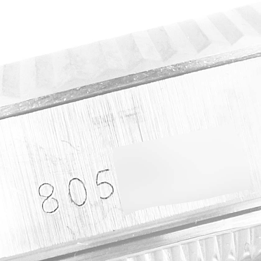 This close-up image shows the serial number engraving on the side of a Rolex Date 69174 Women's Stainless Steel Silver Dial 69174 Women's Stainless Steel Silver Dial model watch.