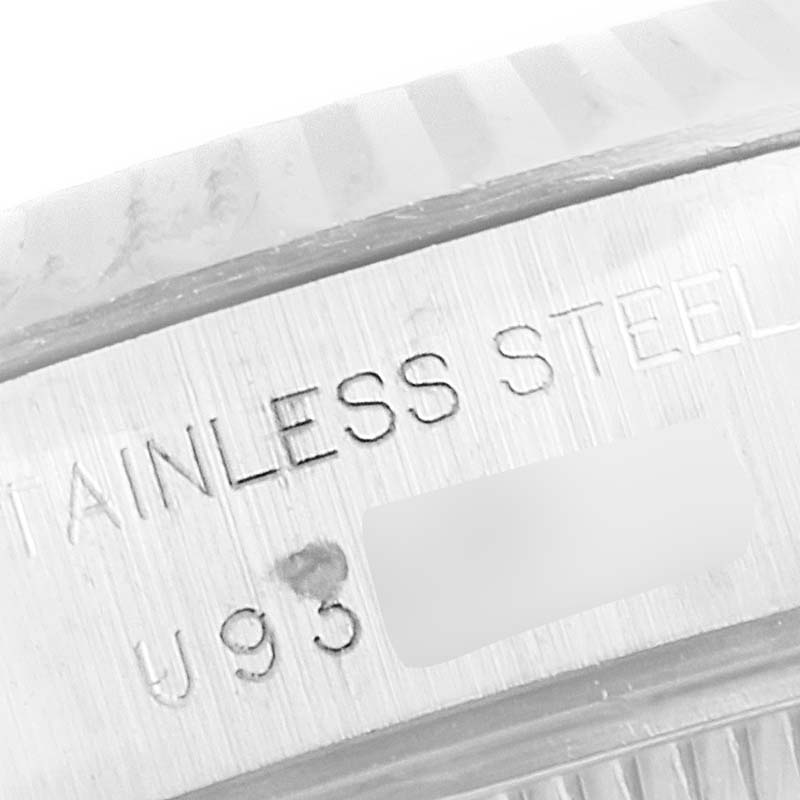 The image shows a close-up of the stainless steel casing with part of the serial number of a Rolex Datejust 69174 Women
s Stainless Steel Silver Dial 69174 Women
s Stainless Steel Silver Dial watch.