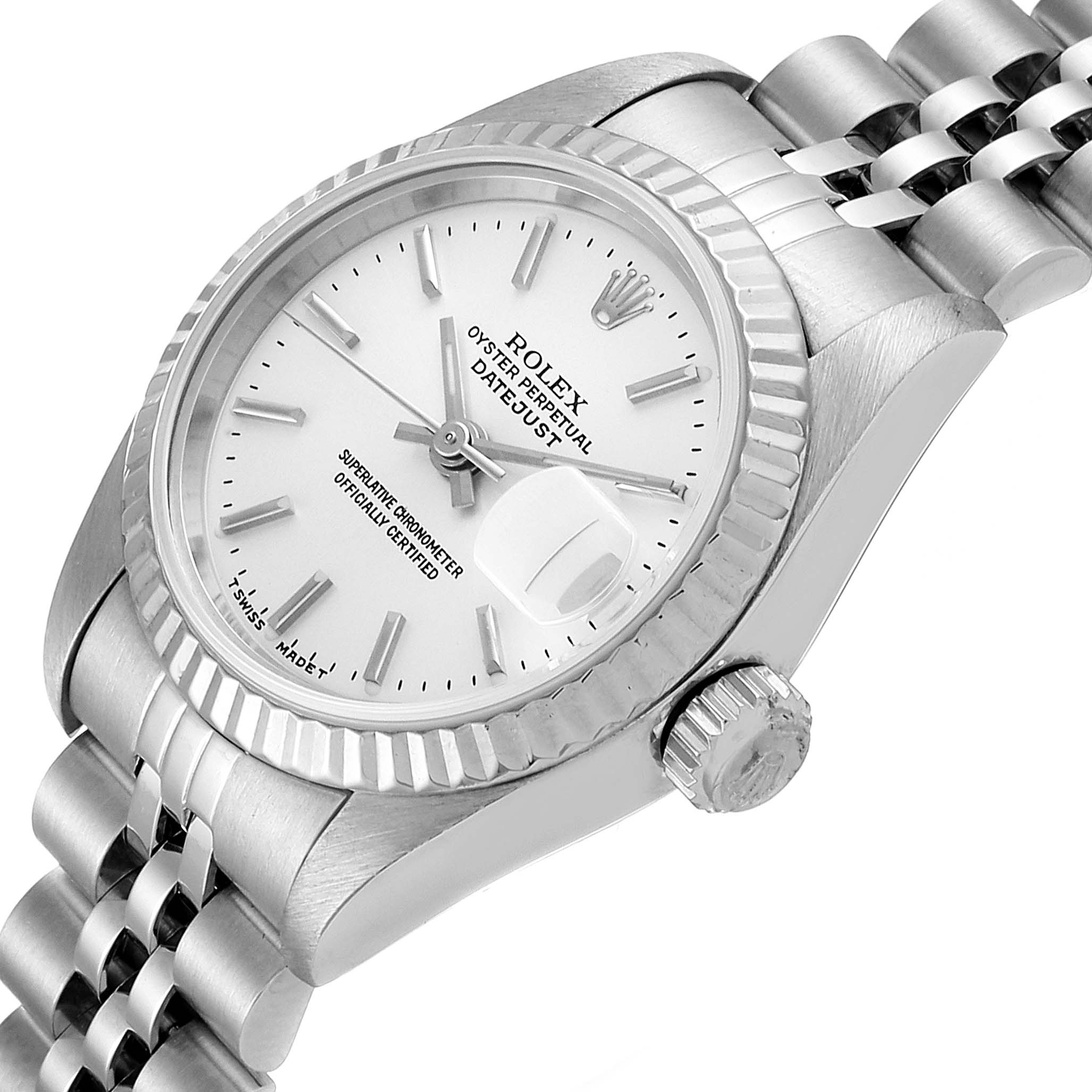 The image shows a Rolex Datejust 69174 Women
s Stainless Steel Silver Dial 69174 Women
s Stainless Steel Silver Dial watch at an angle showcasing the dial, bezel, crown, and part of the bracelet.