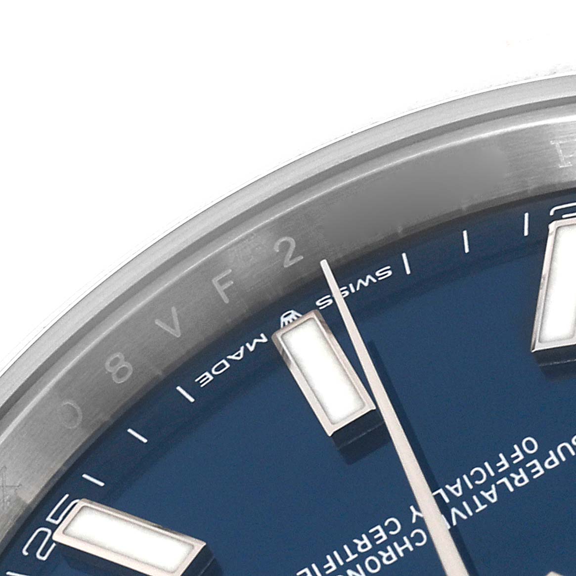 This image of a Rolex Datejust 41 126300 Men's Stainless Steel Blue Dial 126300 Men's Stainless Steel Blue Dial watch shows a close-up of the dial, focusing on the hour markers and part of the bezel.