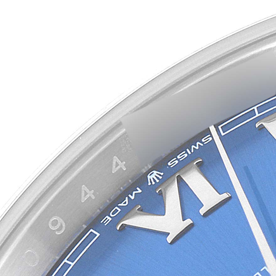 This close-up image shows a portion of the dial and bezel of the Rolex Datejust 41 126300 Men's Stainless Steel Blue Dial 126300 Men's Stainless Steel Blue Dial watch, highlighting the "IV" hour marker and "Swiss Made" text.