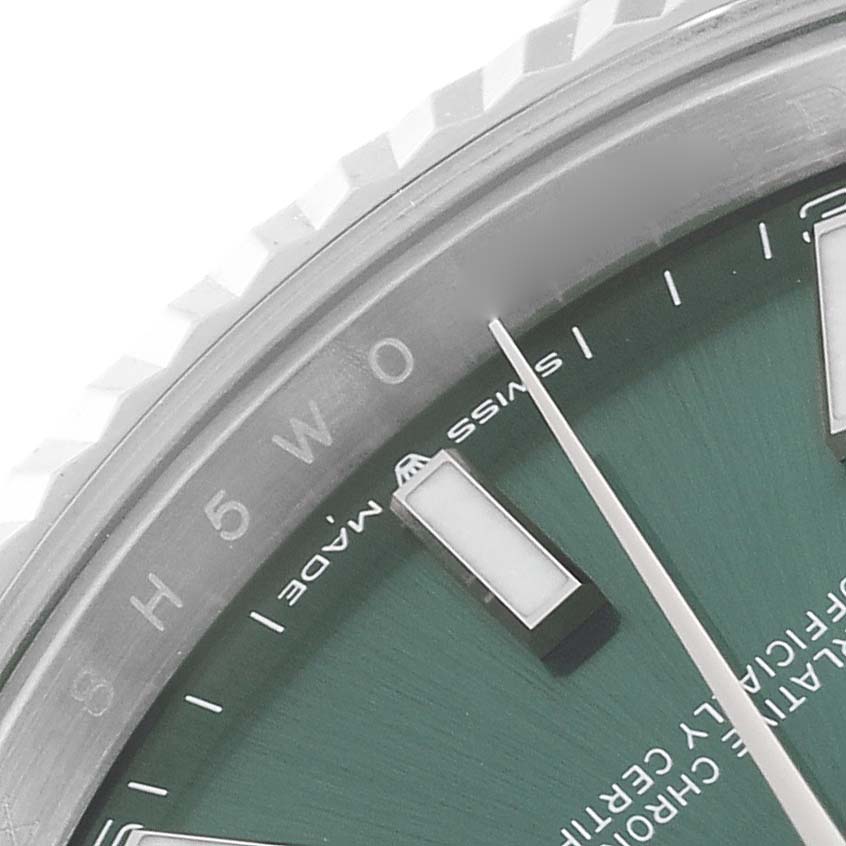 The image shows a close-up of the dial, hands, and part of the bezel of the Rolex Datejust 41 126334 Men
s Stainless Steel Green Dial 126334 Men
s Stainless Steel Green Dial watch.