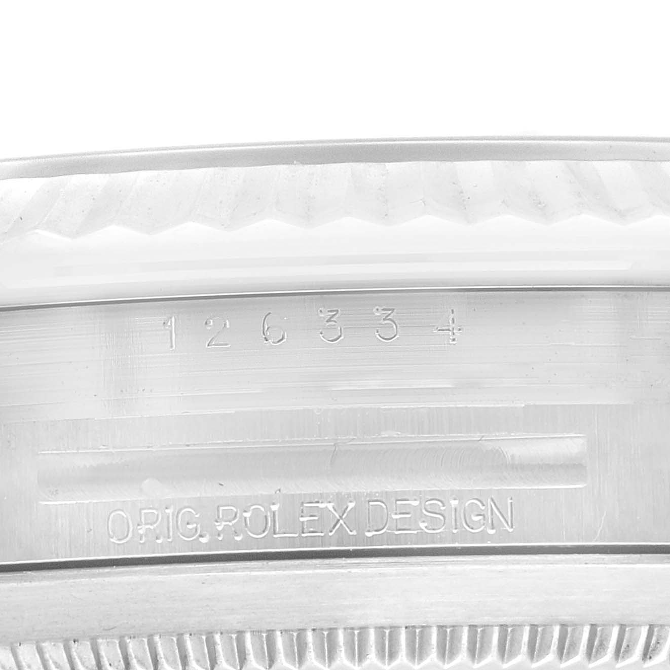 This close-up image of the Rolex Datejust 41 126334 Men
s Stainless Steel Green Dial 126334 Men
s Stainless Steel Green Dial model shows the serial number and engraving on the watch
s case.